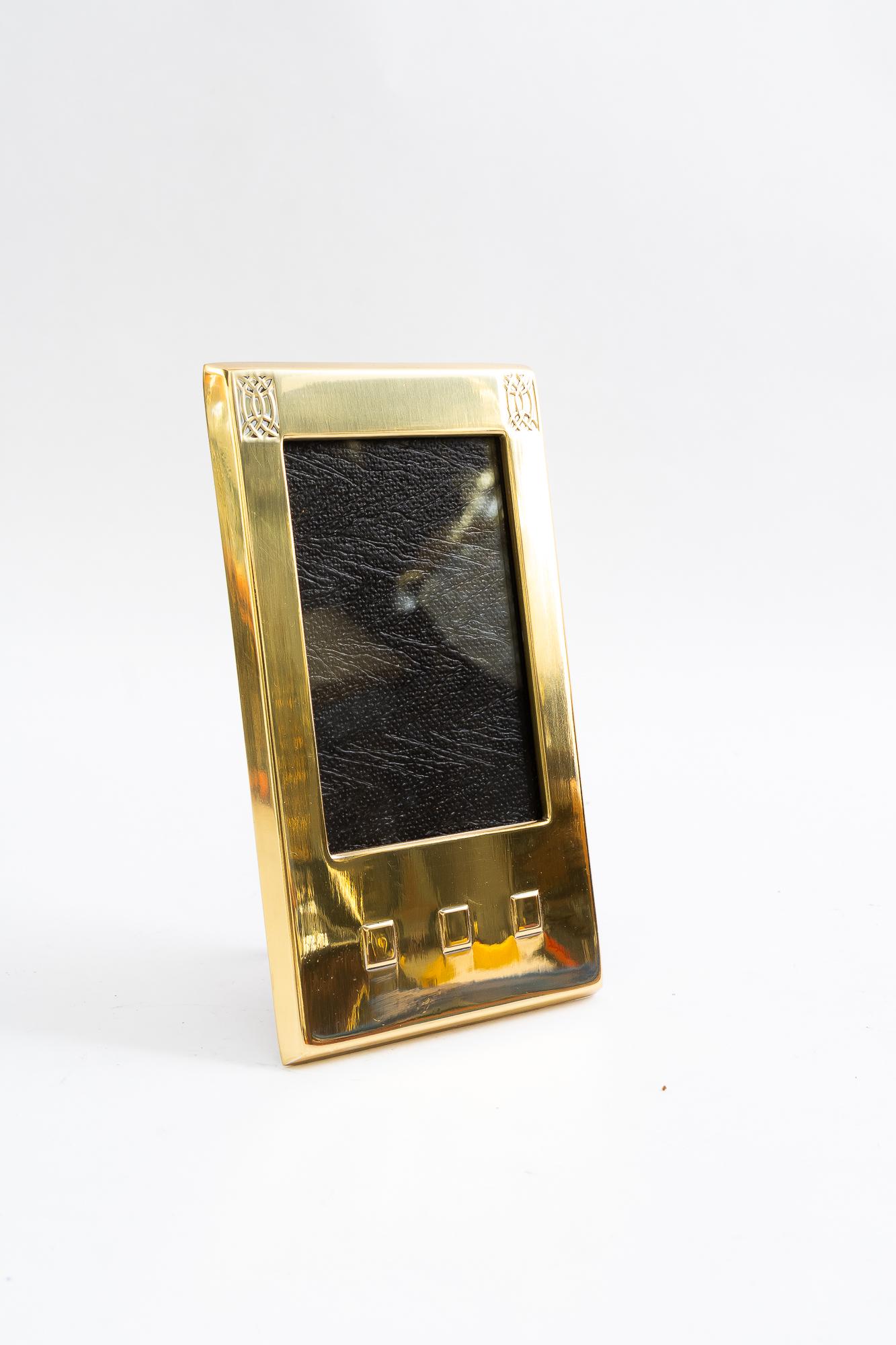 WMF brass picture frame with glass vienna around 1920s ( marked by WMF )
Brass polished and stove enameled
Glass
Max picture size: H: 10cm  W: 6cm