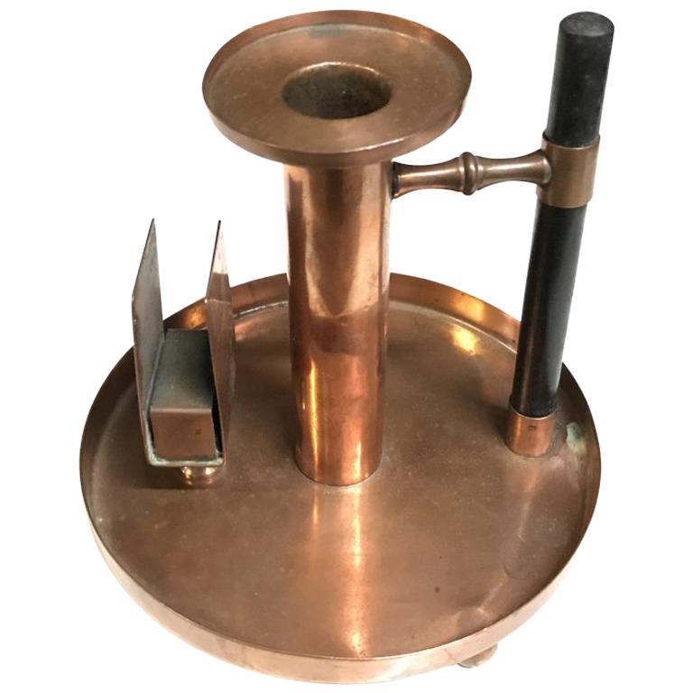 WMF. An Aesthetic Movement Copper Chamber Candlestick in the Dr C Dresser Style For Sale