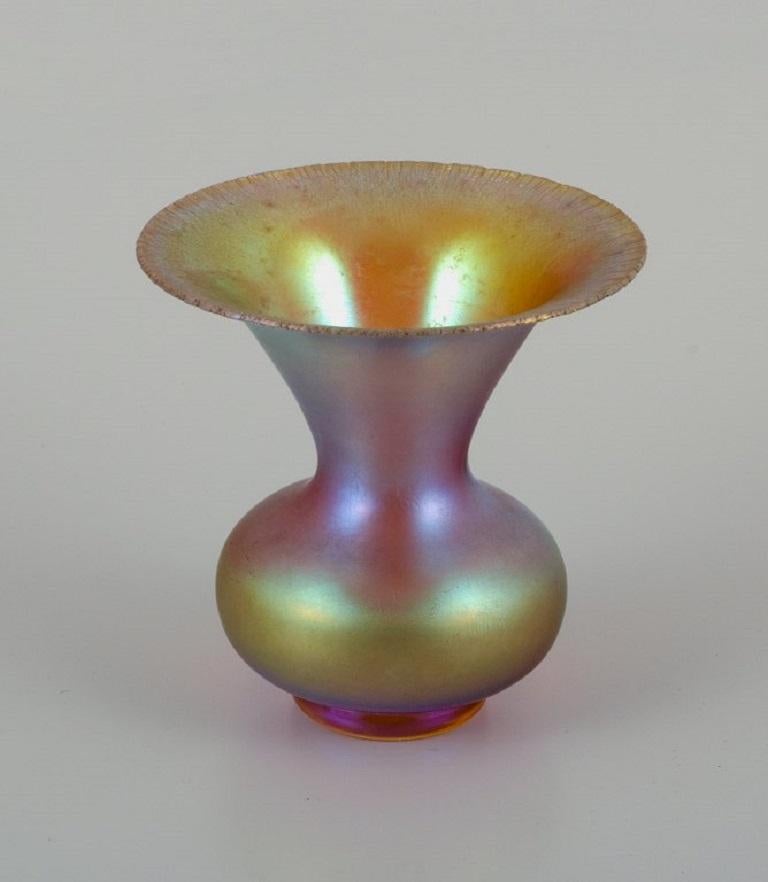 WMF, Germany. Vase in iridescent Myra art glass.
1930s.
In excellent condition.
Dimensions: D 10,5 x H 10,5 cm.