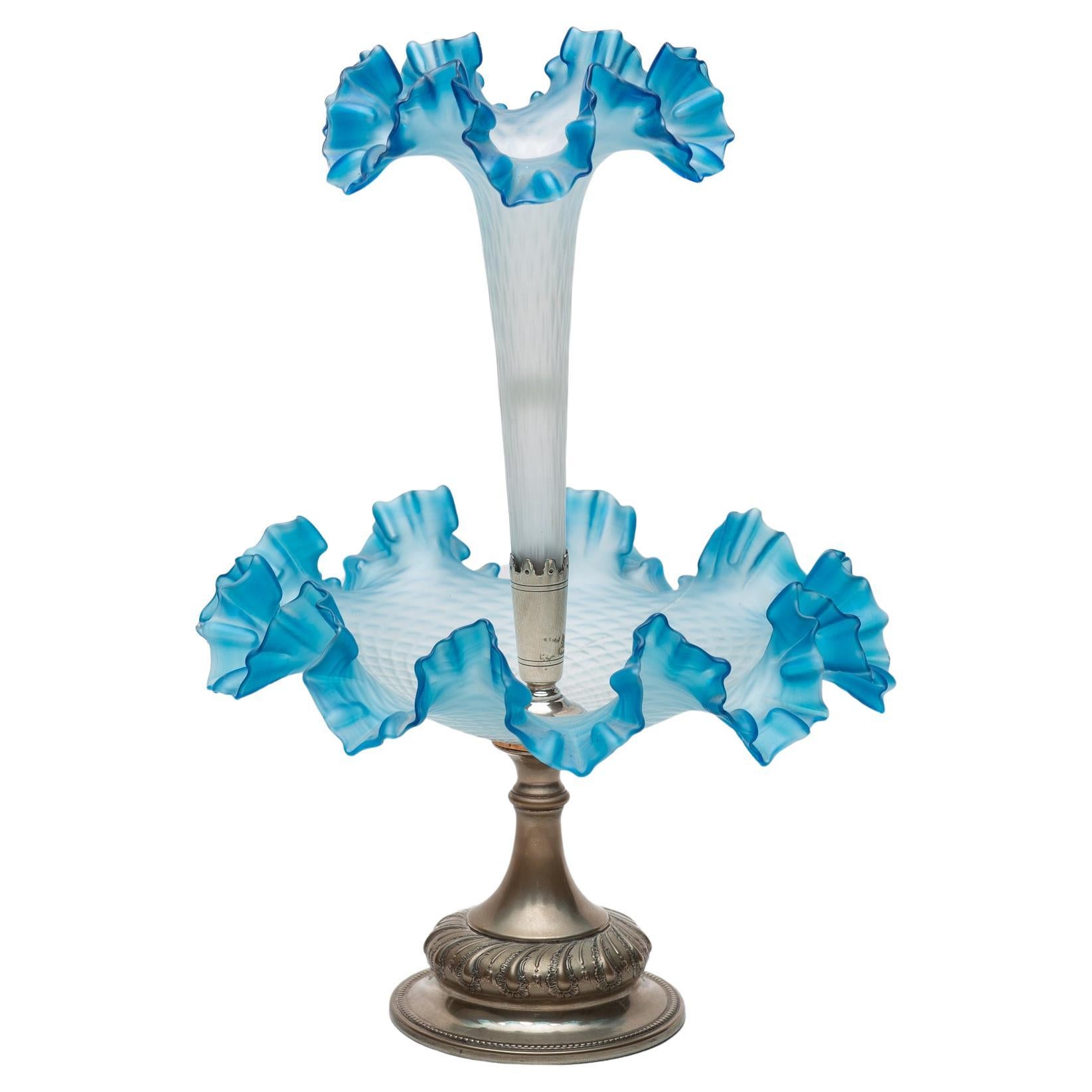 O/6184 - Rare WMF épergne in silver plate and blue glasses, dating back approximately 150/160 years. 
Unfortunately the photographer cracked the larger glass in two places: however it is still whole.
Therefore its value dropped from € 2500 to €
