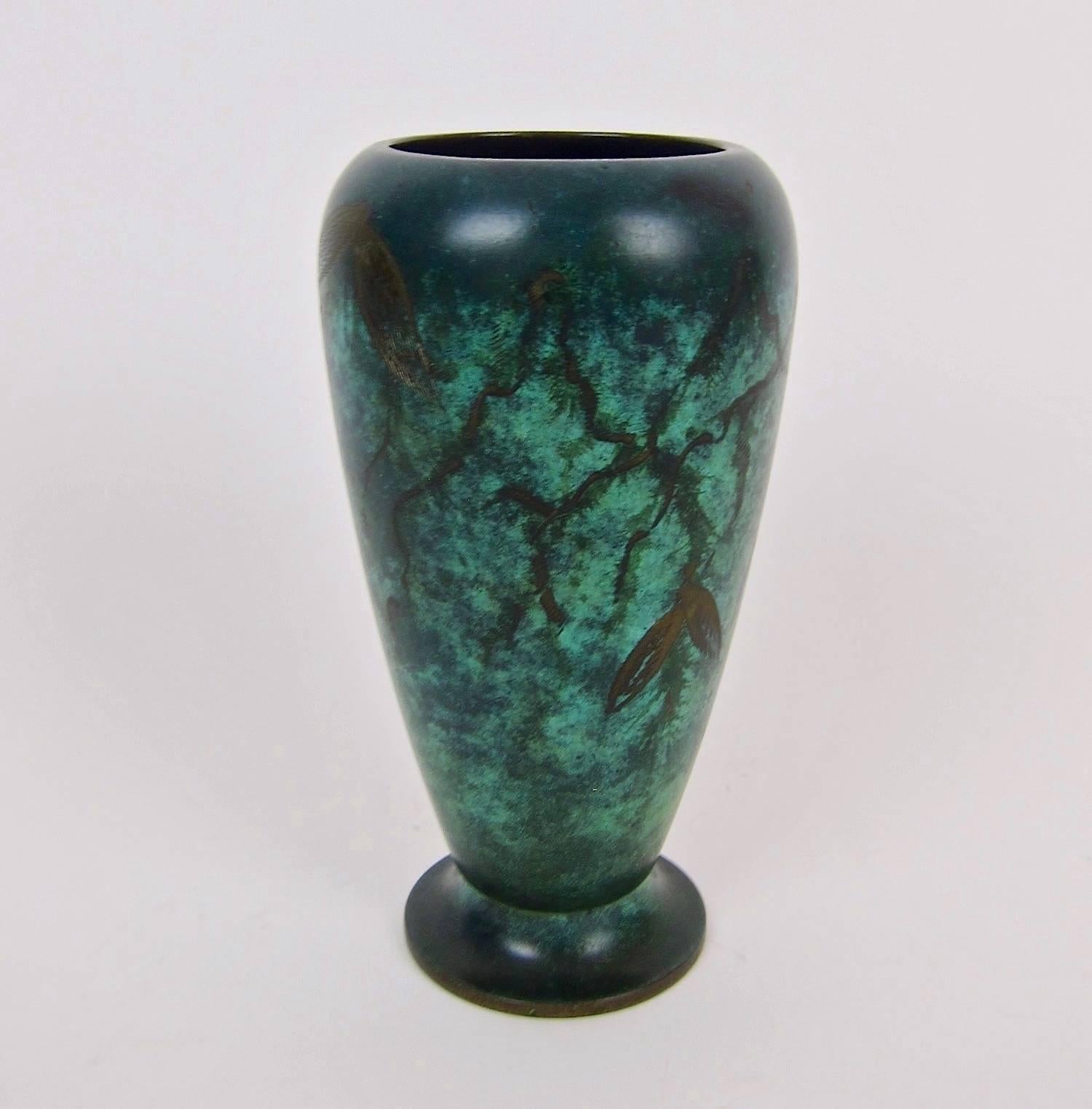 A verdigris art metal vase from the NKA Ikora workshop of WMF AG (Württembergische Metallwarenfabrik) of Geislingen, Germany, dating to the late 1920s. The Art Deco vessel is decorated with a handsome green 'fire patina' that looks like an aged and