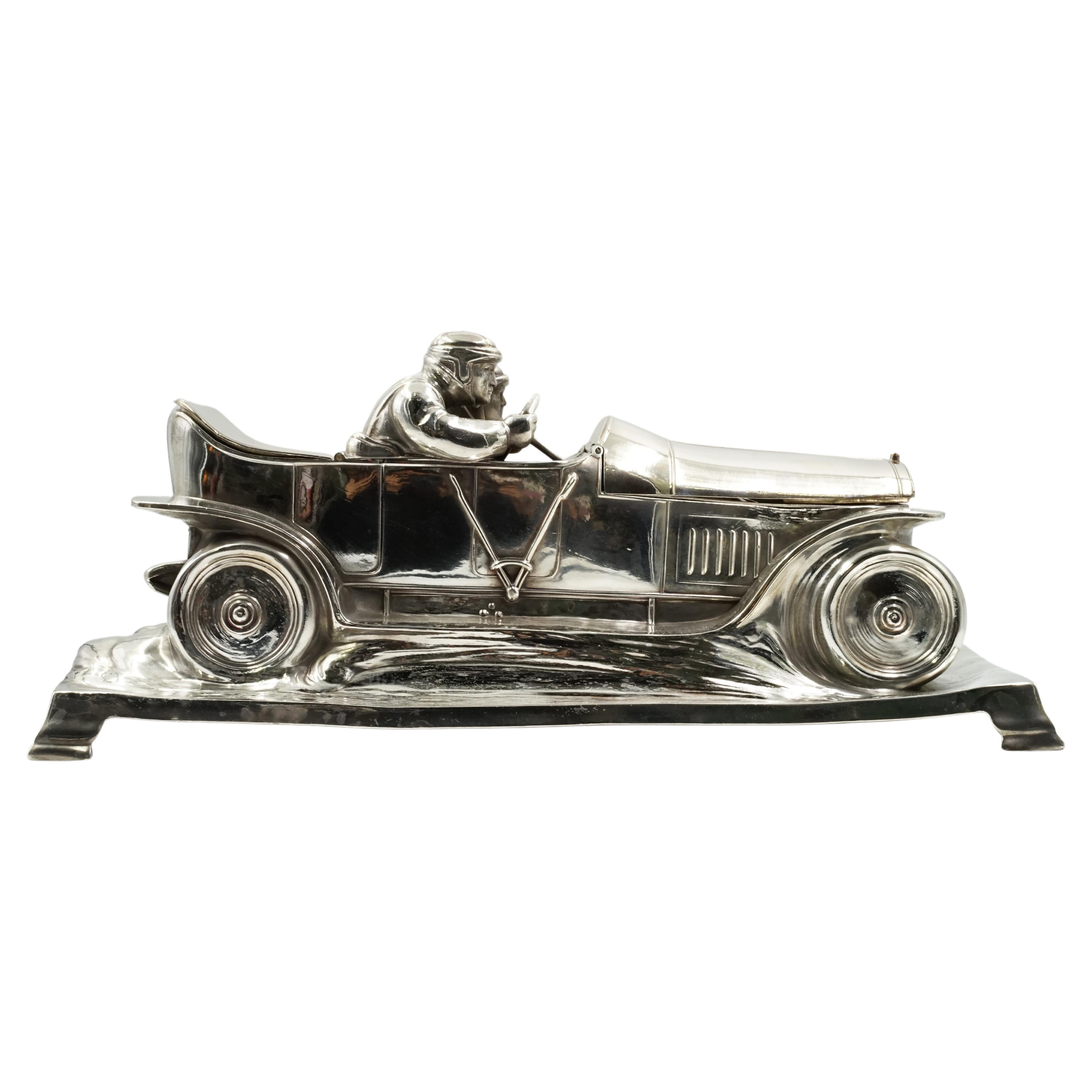 W.M.F inkwell art nouveau racing car
Origin Germany Circa 1915
Excellent condition. It has all its original parts
Electroplated metal
Sealed on the back
The car is a Mercedes Benz of the time.
WMF was originally called Metallwarenfabrik Straub &