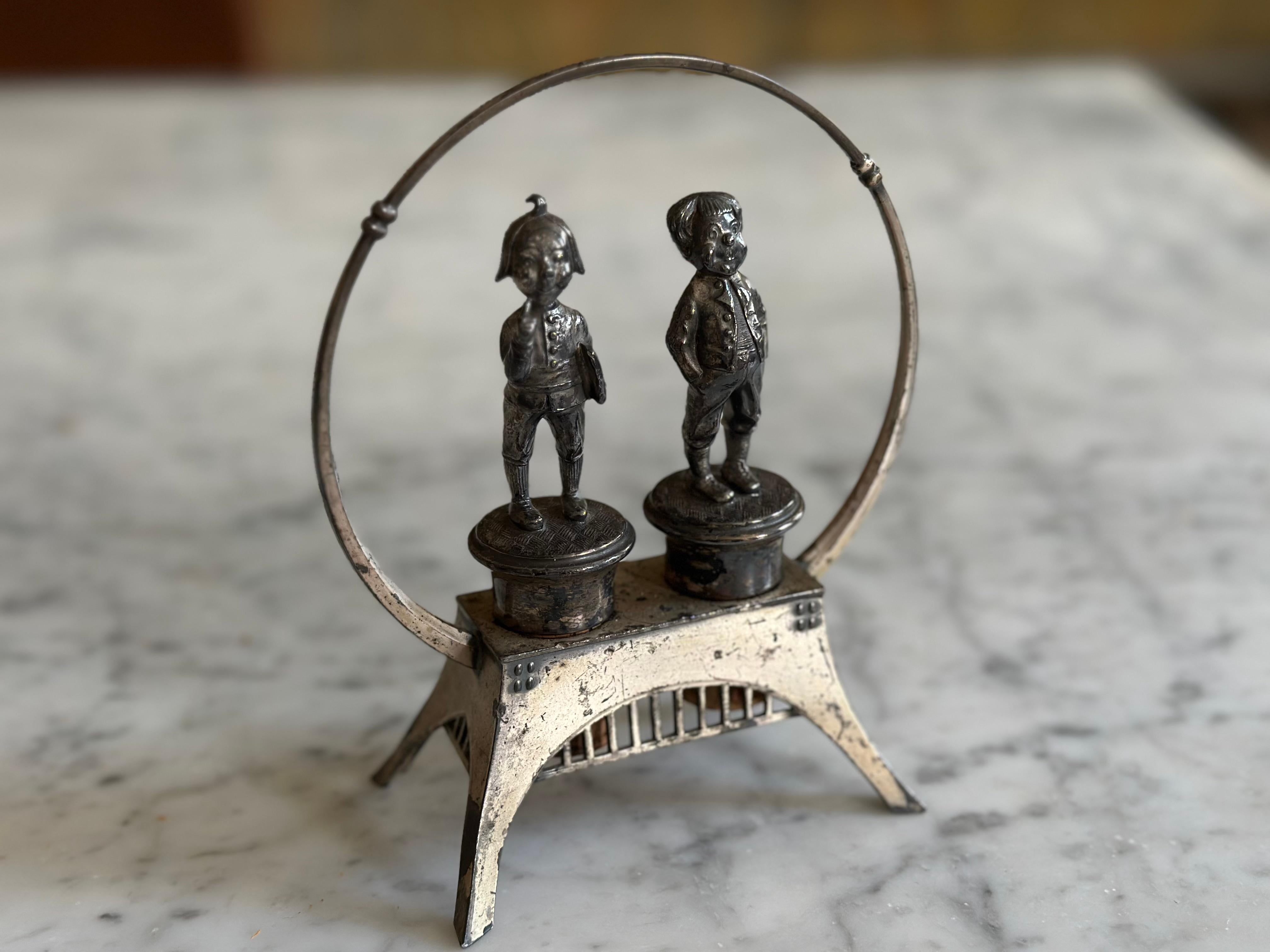 This charming Jugendstil cork holder by WMF dates back to around 1900 and features the famous Wilhelm Busch characters Max and Moritz. Crafted from silver-plated metal and marked with the WMF ostrich hallmark, this rare piece combines playful