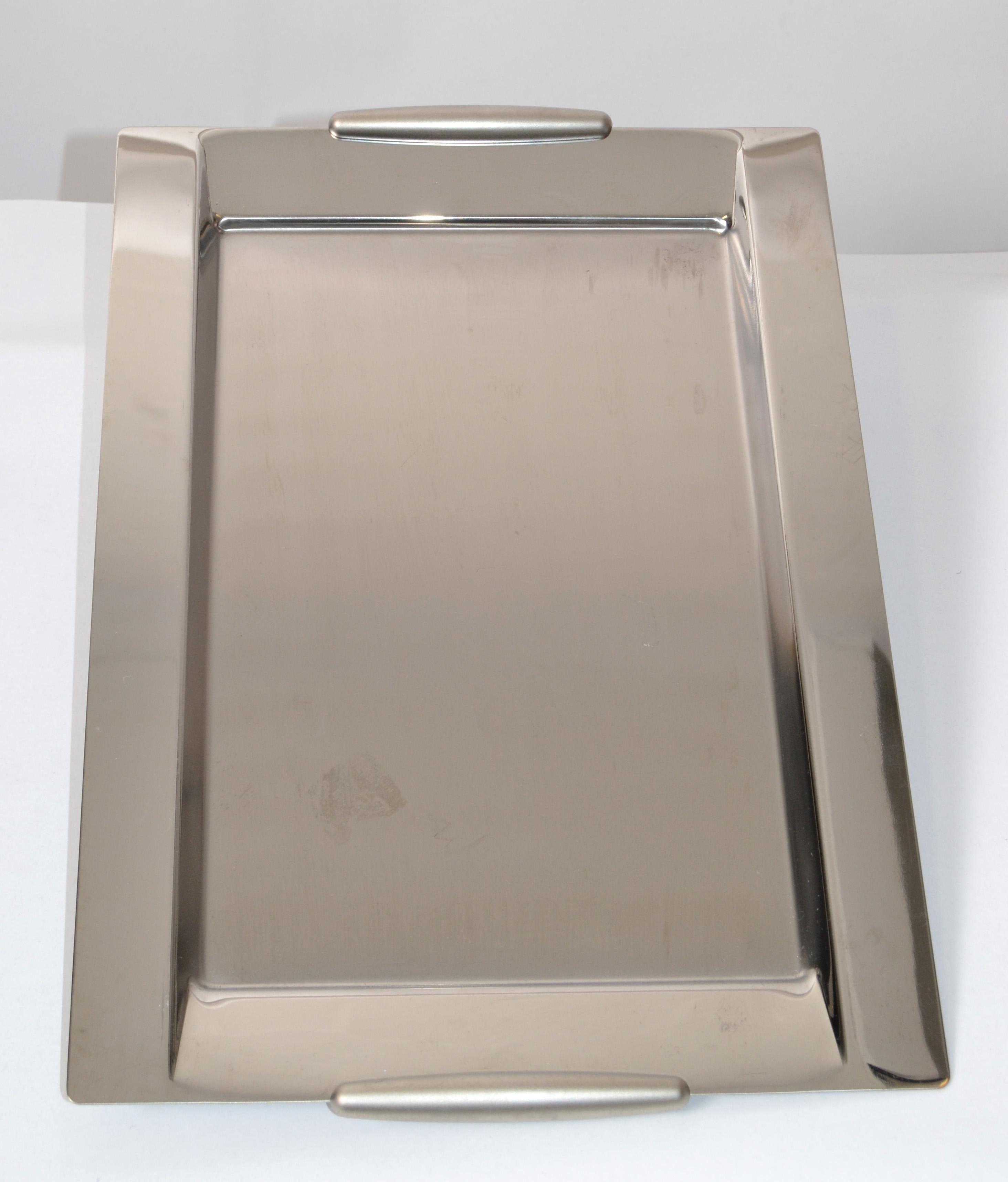 Mid-Century Modern decorative serving tray or platter made out of stainless steel 18/10 made in Italy by WMF Pinnacle Italy.
Marked at the Base.