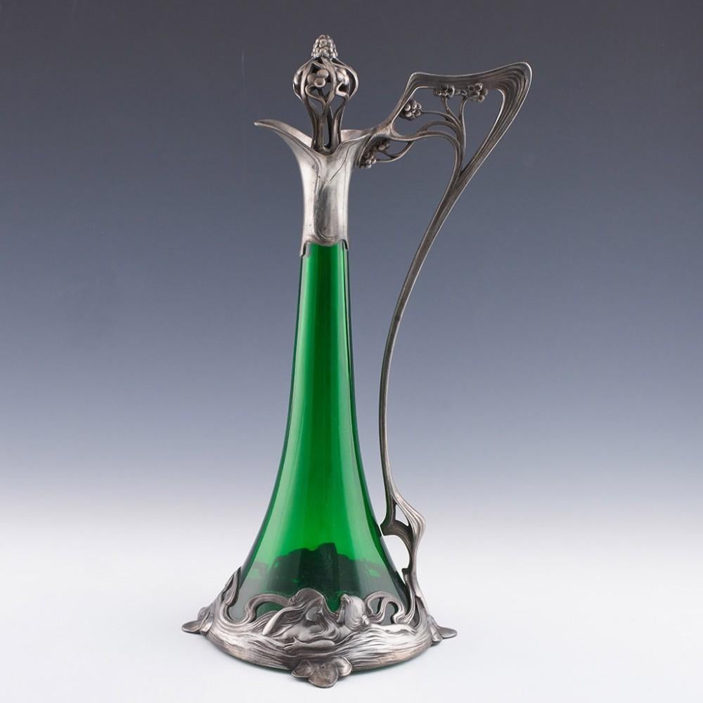 Heading : WMF silver plate and green glass claret jug
Date : c1900 - has a WMF export mark with a date range of 1880-1903, however, this design first came out towards the end of this period
Origin : Gieslingen-an-der-Steige
Colour : Silver with