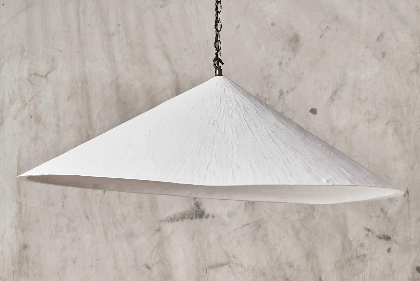 Our bestselling Wobble Light offers a distinctive and modern aesthetic whilst retaining a hand crafted textured quality.
The plaster material has a chalky soft look, which, combined with the angles and the wonky bottom edge make it a unique and