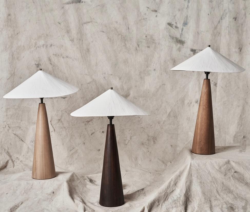 The Wobble Table Lamp casts a warm downwards light, creating an atmospheric glow to any room. 
Incorporating our original scaled down plaster wobble shade, paired with a beautiful hand turned iroko wooden base, the Wobble Table Lamp offers a
