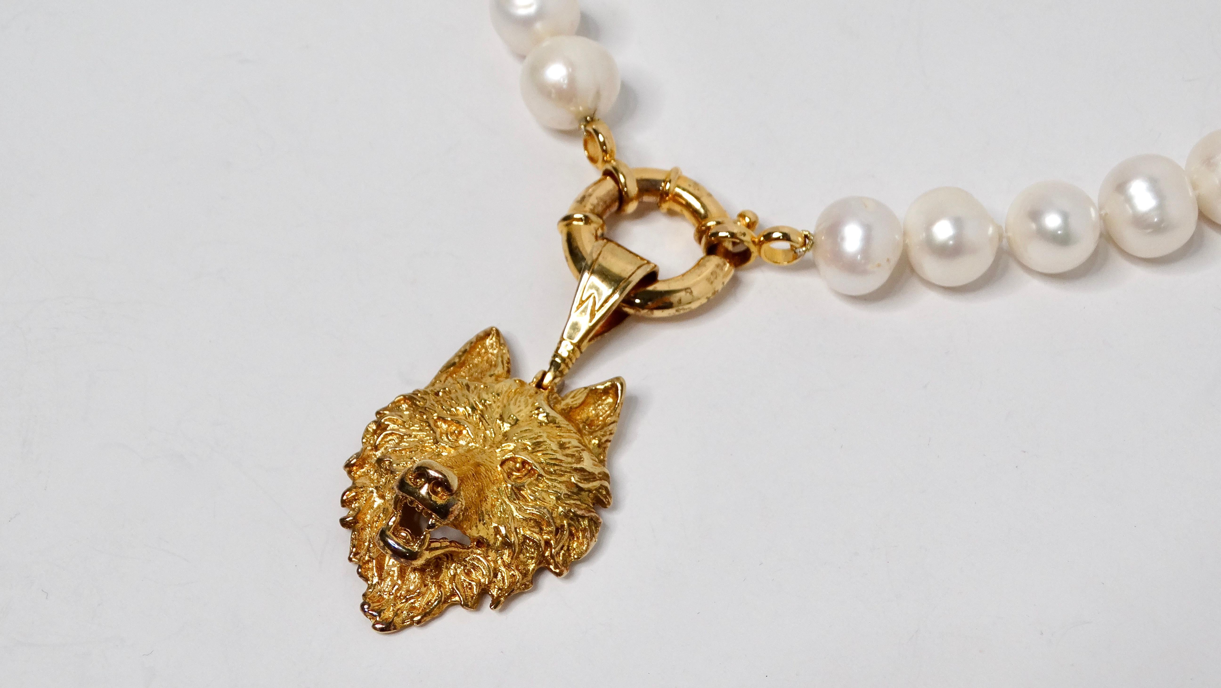 The Wolf Gold-Plated Sterling Silver Pendant & Freshwater Pearl Strand Necklace is a stunning blend of nature-inspired design and timeless elegance. This exquisite necklace features a beautifully crafted wolf pendant at the center, made from