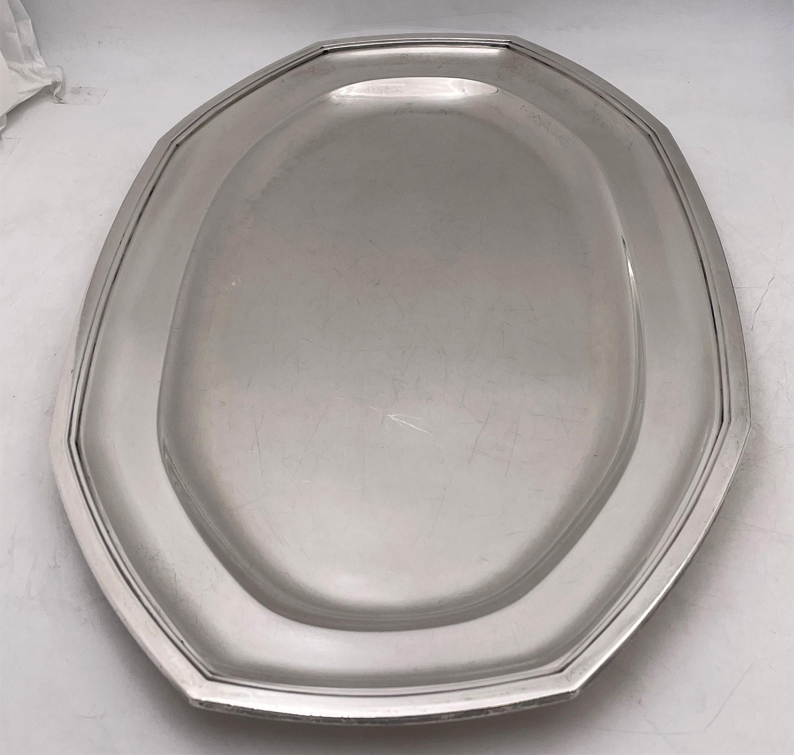 Wolfers, Belgian silver platter or tray, from the early 20th century, in Art Deco style with beautiful geometric accents and design. It measures 19 2/3'' in length by 12 1/8'' in width by 1'' in height, weighs 44.9 troy ounces, and bears hallmarks