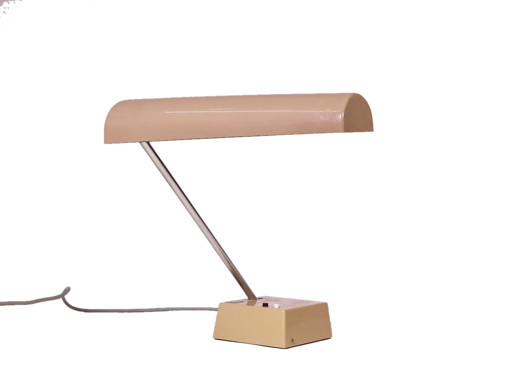 Adjustable desk lamp 'Odette' Type TL 218 designed by Bauhaus member Wolfgang Tuempel and produced by Waldmann Leuchten, Germany in the 1960s. 

Wolfgang Tuempel (1903-1978) was a Bauhaus designer. His work is represented in the collection of the