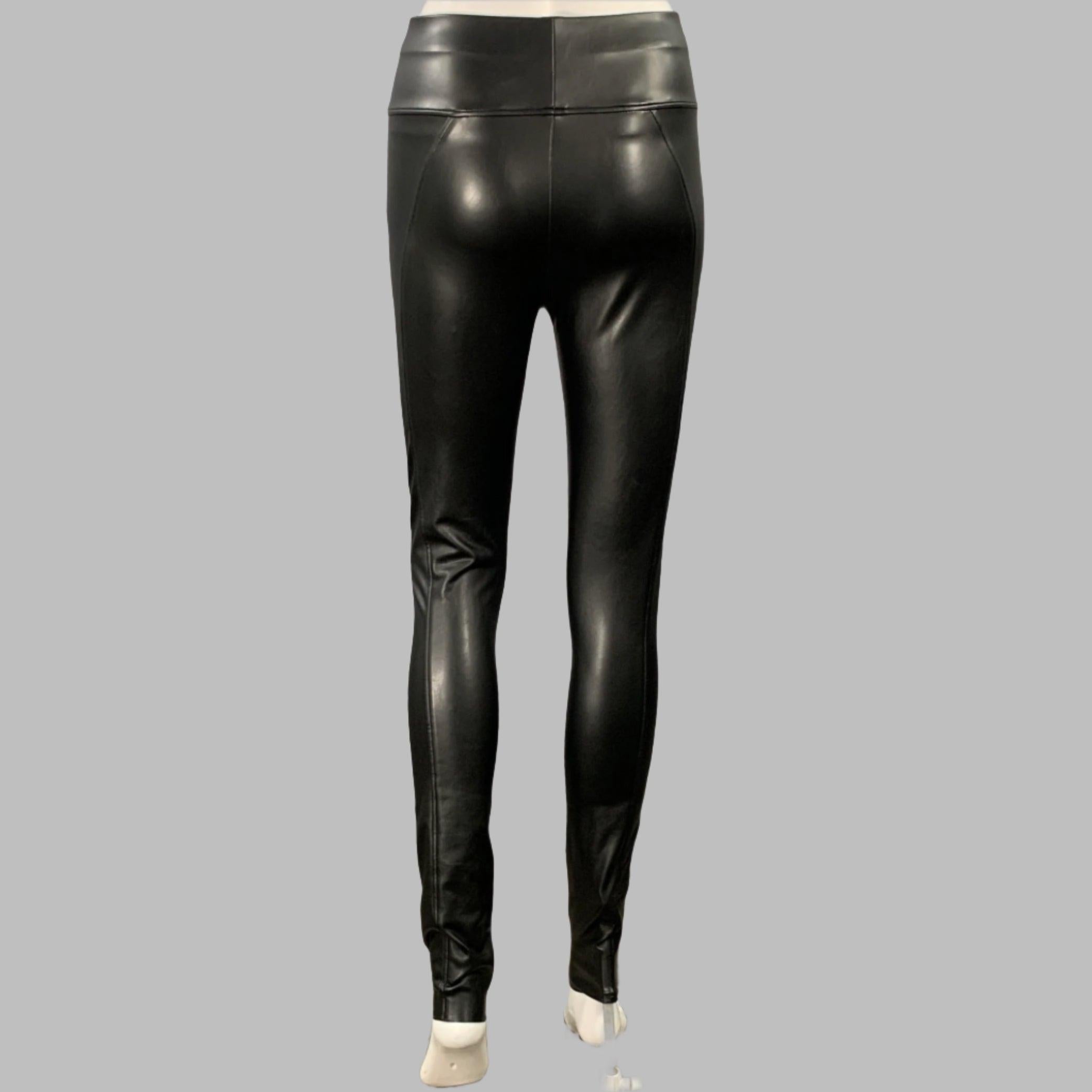WOLFORD leggings
in a black polyester blend faux leather featuring a high waisted style, and pull on closure. Made in Croatia.Very Good Pre-Owned Condition. Minor signs of wear. 

Marked:   IT 38 

Measurements: 
  Waist: 24 - 30 inches Rise: 10.5