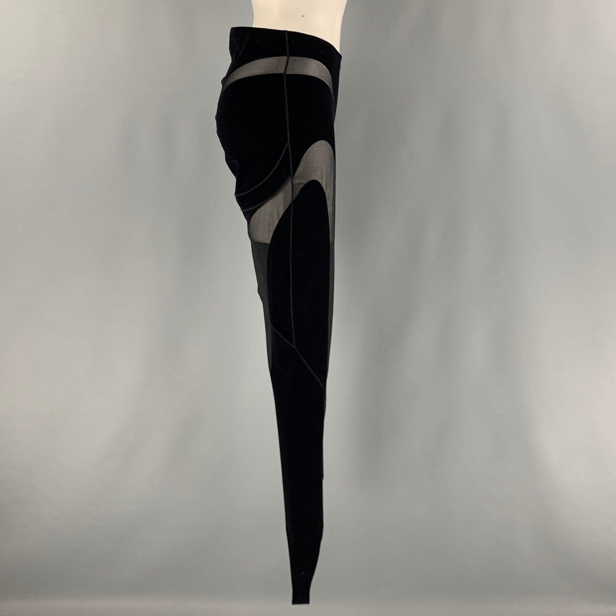 WOLFORD MUGLER leggings comes in a black knit material featuring a jodhpurs style, simulated cut outs design, and elastic waist. Very Good Pre-Owned Condition. No Tags. 

Marked:   no size marked. 

Measurements: 
  Waist: 28 inches Rise: 10 inches