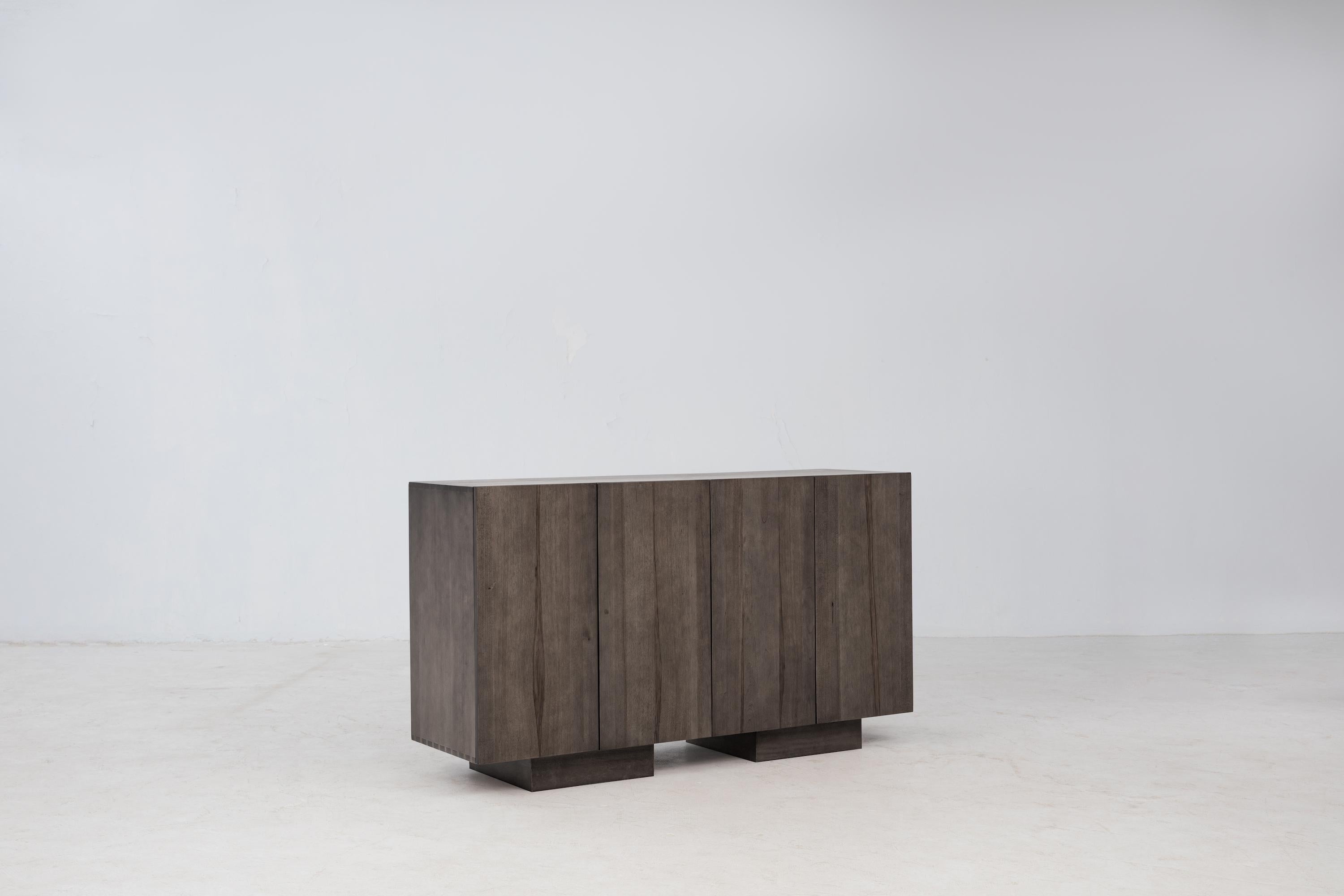 The Wolo Sideboard focuses on the beautiful grain and natural characteristics of Makata Wood, with solid front panels that emphasize the beautiful contrasting grains, color, and natural characteristics of Makata, along with a luminescent sheen that