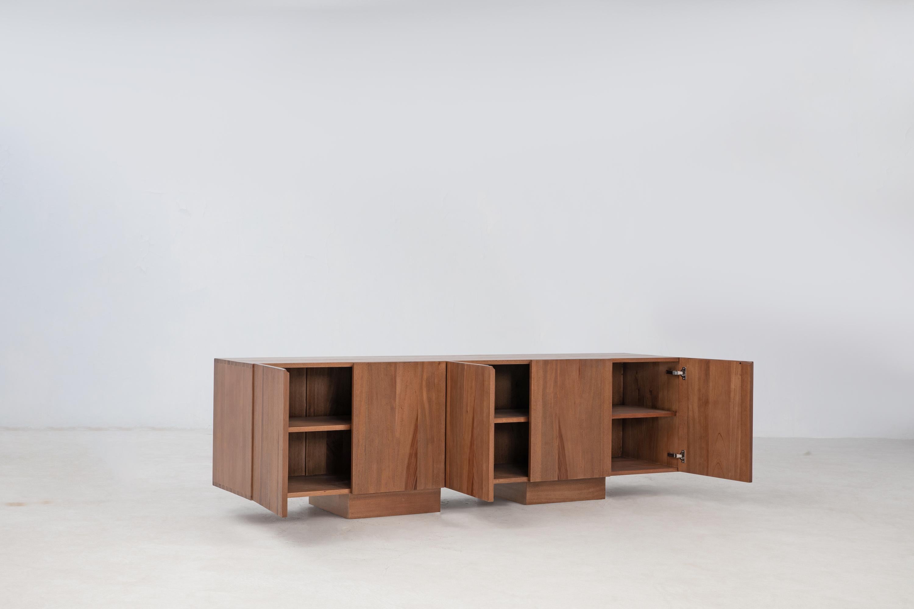 The Wolo Media Cabinet focuses on the beautiful grain and natural characteristics of Makata Wood, with solid front panels that emphasize the beautiful contrasting grains, color, and natural characteristics, along with a luminescent sheen that
