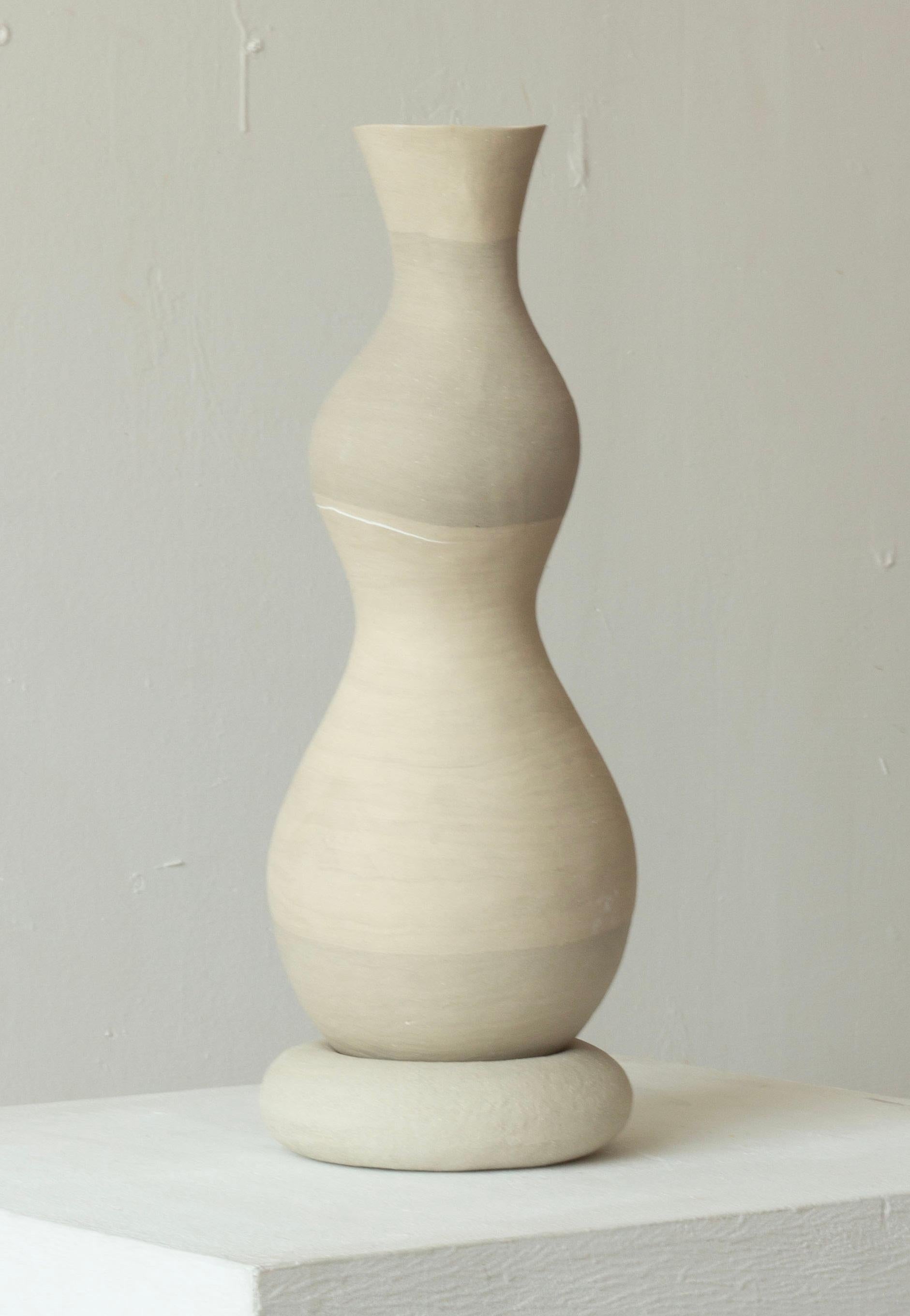 Woman 208 Vase by Karina Smagulova
One of a Kind.
Dimensions: Ø14 x H 38 cm.
Materials: White and grey stoneware.
​
With an Armenian and Kazakhstan heritage, Karina Smagulova was born in Greece in 1995 and graduated with a diploma in Architecture