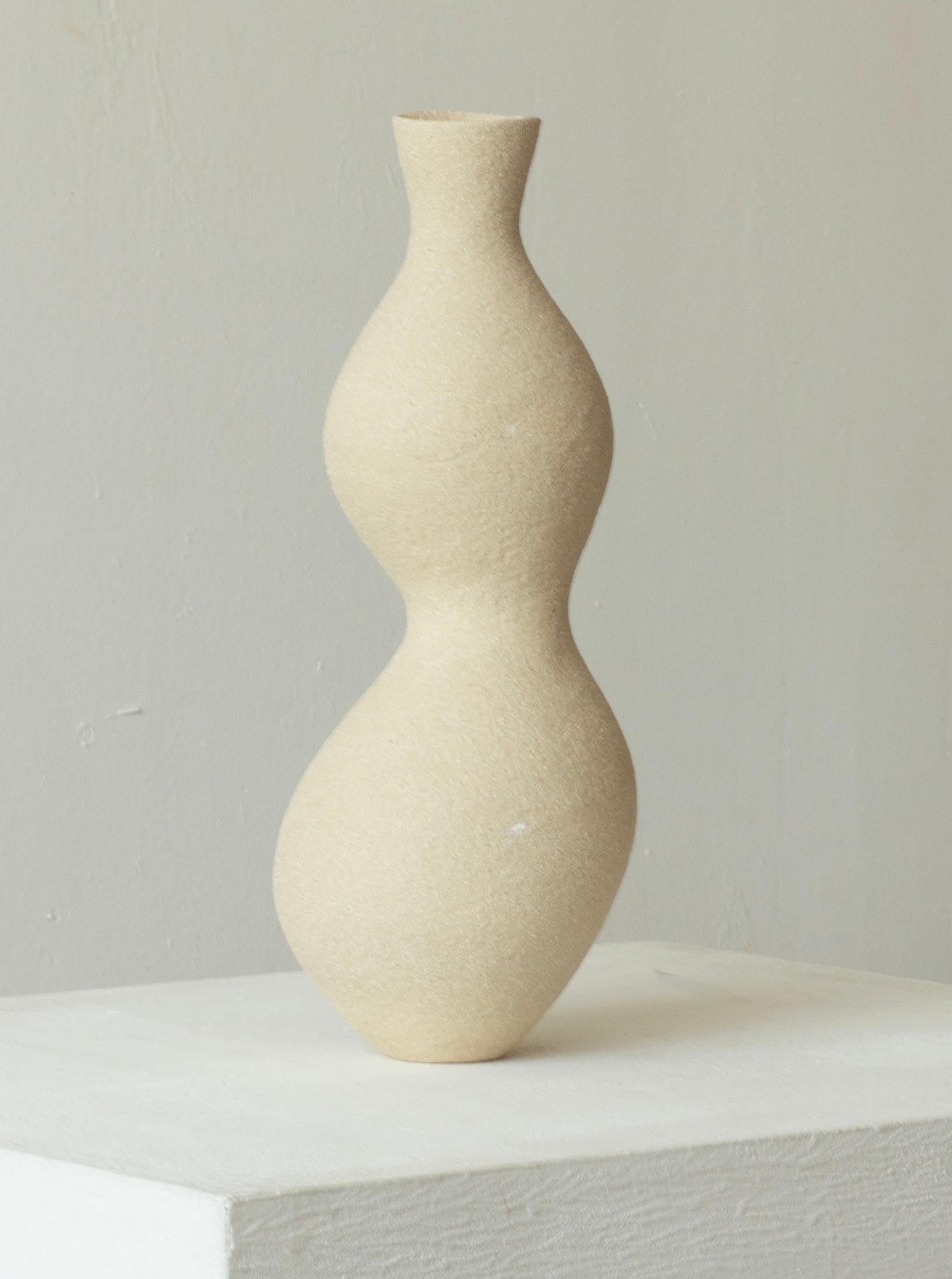Woman 209 Vase by Karina Smagulova
One of a Kind.
Dimensions: Ø 11 x H 31 cm.
Materials: White stoneware.
​
With an Armenian and Kazakhstan heritage, Karina Smagulova was born in Greece in 1995 and graduated with a diploma in Architecture from