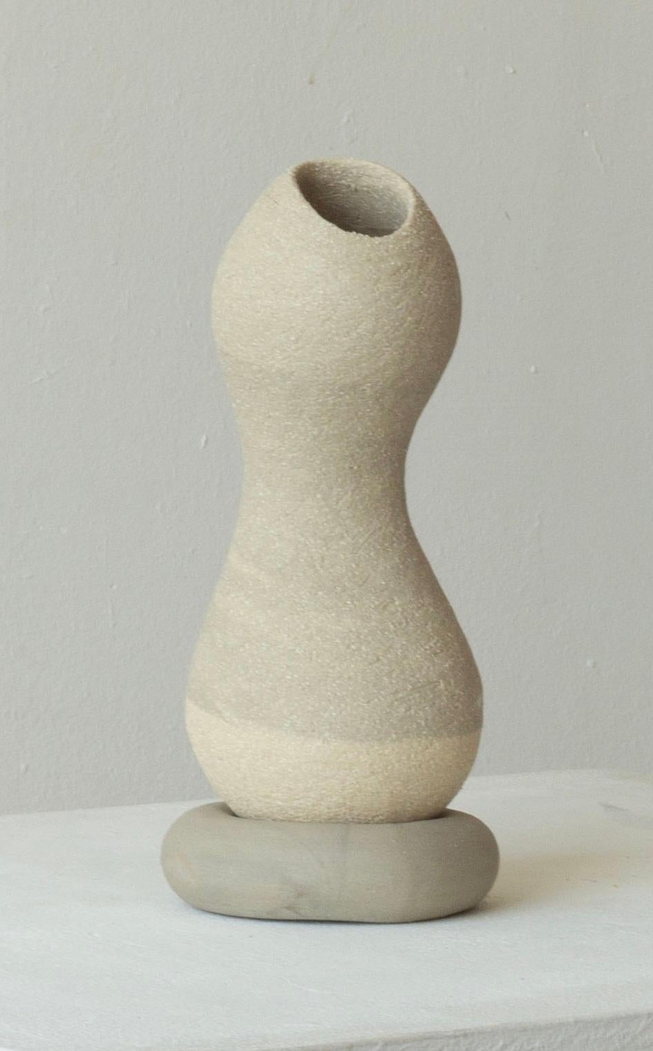 Woman 219 Vase by Karina Smagulova
One of a Kind.
Dimensions: Ø 8 x H 19 cm.
Materials: Grey stoneware.
​
With an Armenian and Kazakhstan heritage, Karina Smagulova was born in Greece in 1995 and graduated with a diploma in Architecture from