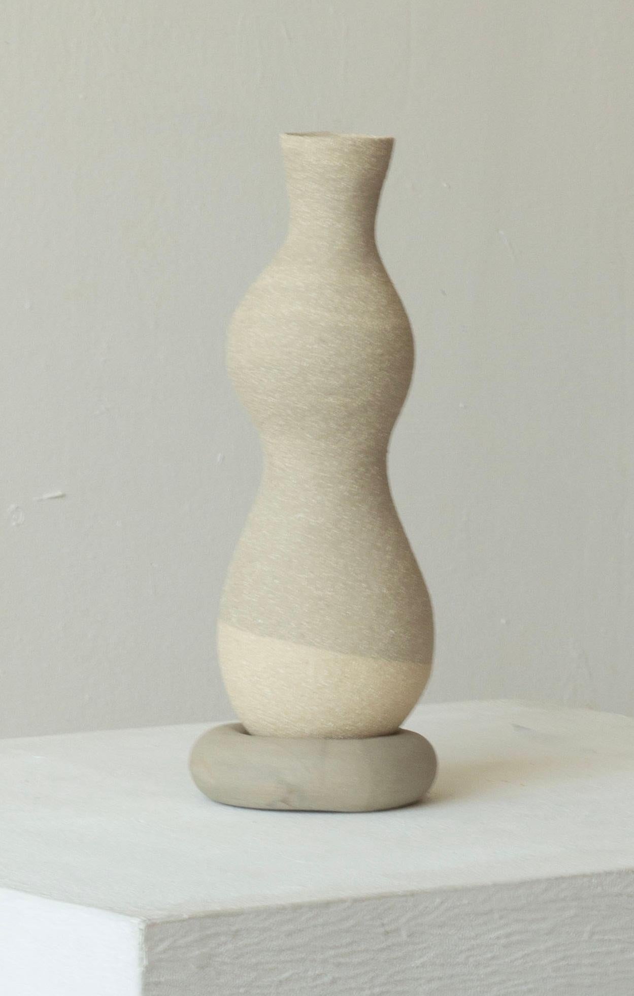 Woman 219 Vase by Karina Smagulova
One of a Kind.
Dimensions: Ø 8 x H 24 cm.
Materials: Grey stoneware.
​
With an Armenian and Kazakhstan heritage, Karina Smagulova was born in Greece in 1995 and graduated with a diploma in Architecture from