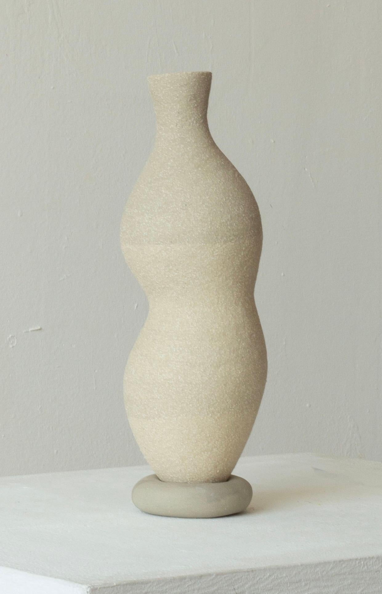 Woman 220 Vase by Karina Smagulova
One of a Kind.
Dimensions: Ø 9 x H 27 cm.
Materials: Grey stoneware.
​
With an Armenian and Kazakhstan heritage, Karina Smagulova was born in Greece in 1995 and graduated with a diploma in Architecture from