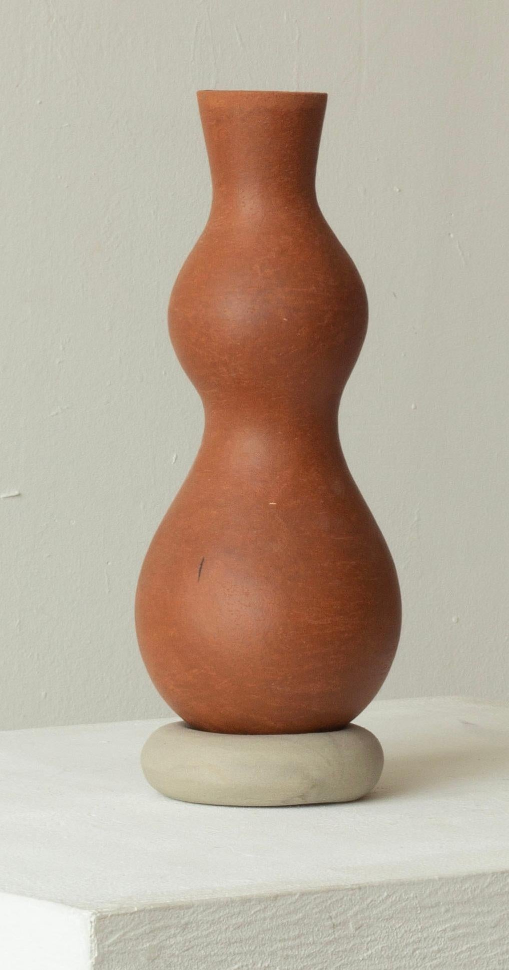 Woman 226 Vase by Karina Smagulova
One of a Kind.
Dimensions: Ø 10 x H 24 cm.
Materials: Terracotta and grey stoneware.
​
With an Armenian and Kazakhstan heritage, Karina Smagulova was born in Greece in 1995 and graduated with a diploma in