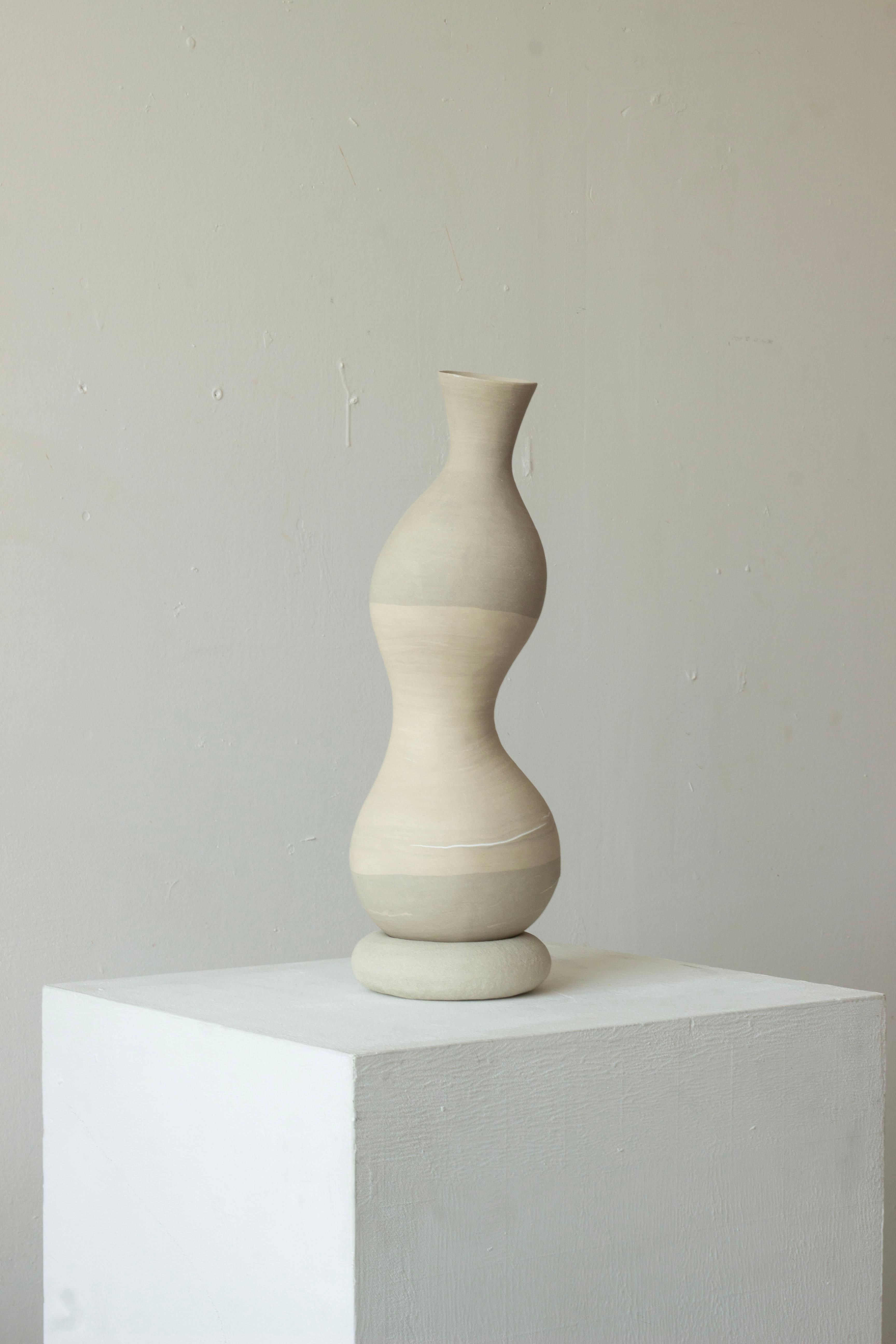 Woman Cracked But Healed 205 by Karina Smagulova
One of a Kind.
Dimensions: Ø 15 x H 43 cm.
Materials: White and grey stoneware and epoxy.
​
With an Armenian and Kazakhstan heritage, Karina Smagulova was born in Greece in 1995 and graduated with a