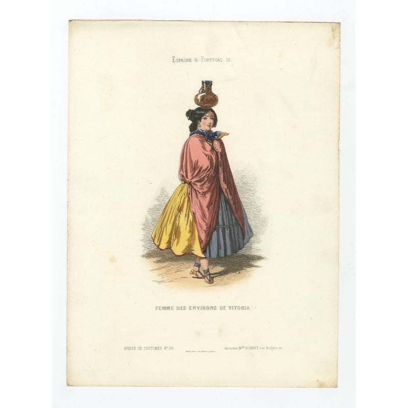 Antique costume print titled 'Femme des Environs de Vitoria'. Old print depicting a woman from the region of Vitoria, Spain. This print originates from 'Costumes Moderne (Musée de Costumes). 

Artists and Engravers: Published in Paris: Ancienne