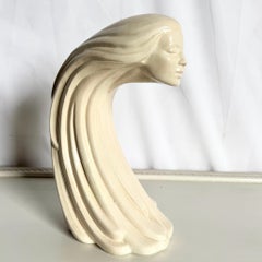 "Woman of the Wind" or "Moderne Frauenbüste Mit Langem Haar Aus Steinguss
