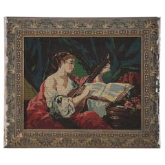 Frau spielt mit dem Lute-Wandteppich in Rahmen