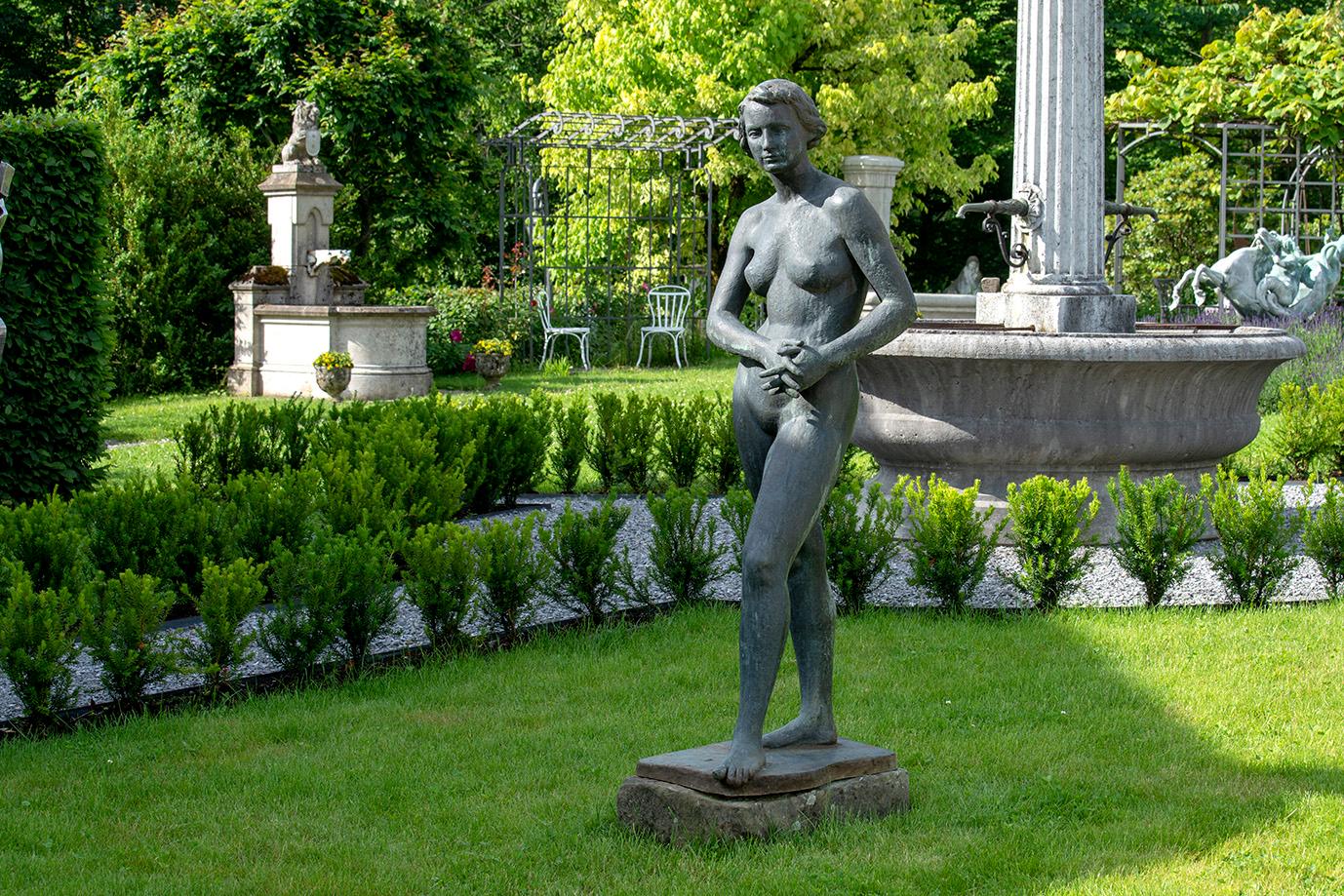 Signed by H. Jörin in 1952, this sculpture of a woman is exquisite. Hanns Jörin (the sculptor) lived from 1888-1961 in Switzerland. Featured in our garden we have a female sculpture in bronze with a bottom plate signed 