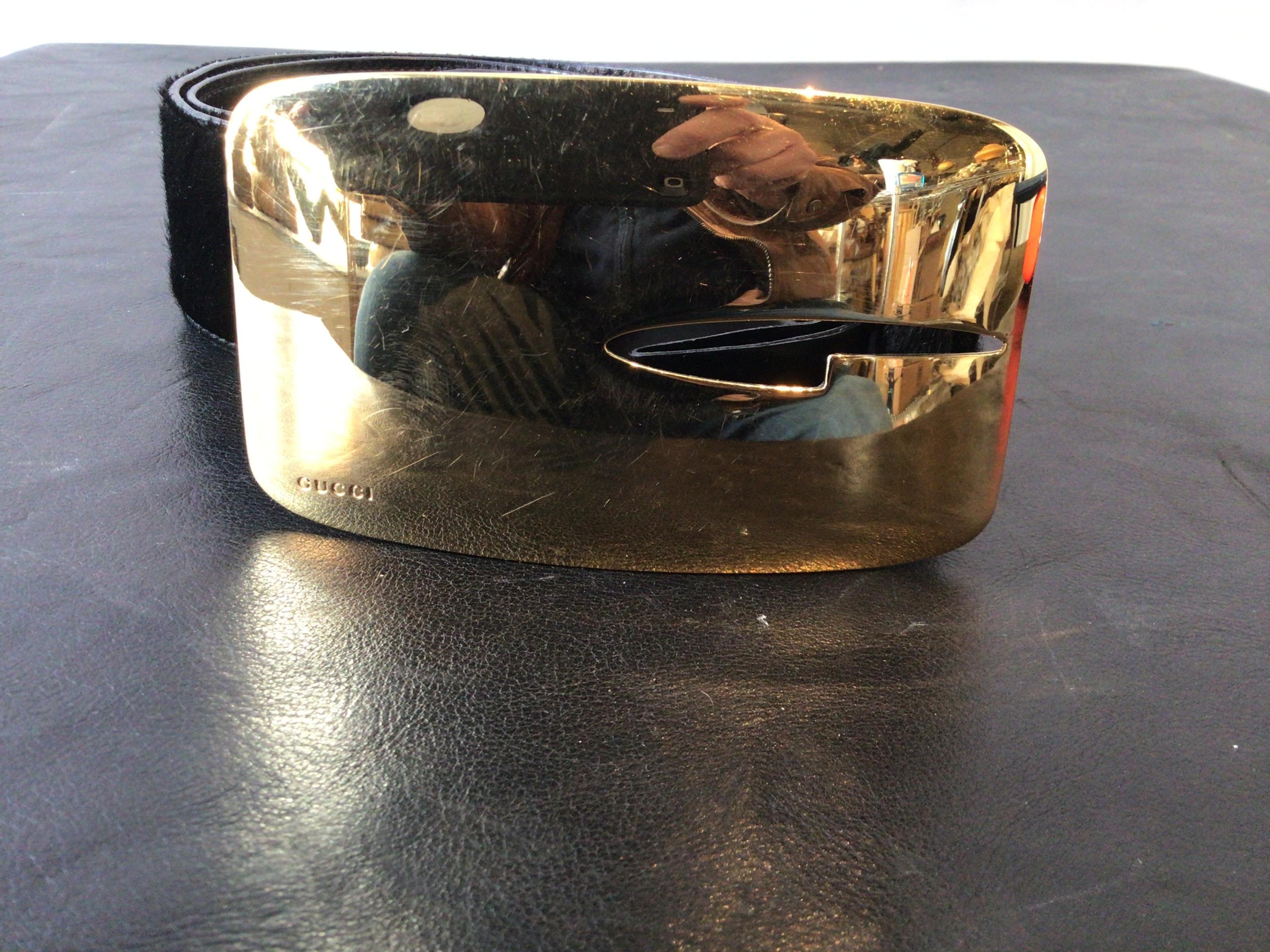 Woman’s Gucci pony hair belt with brass buckle.