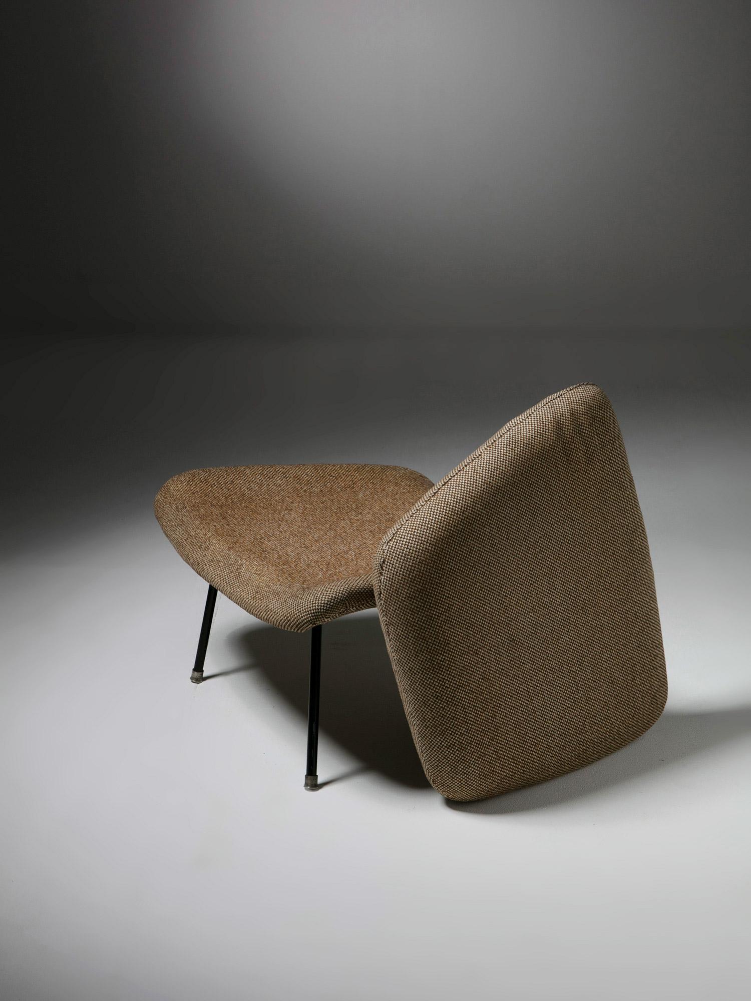 Ottoman by Eero Saarinen for Knoll
The piece is constructed of foam cushion over moulded plywood.
 