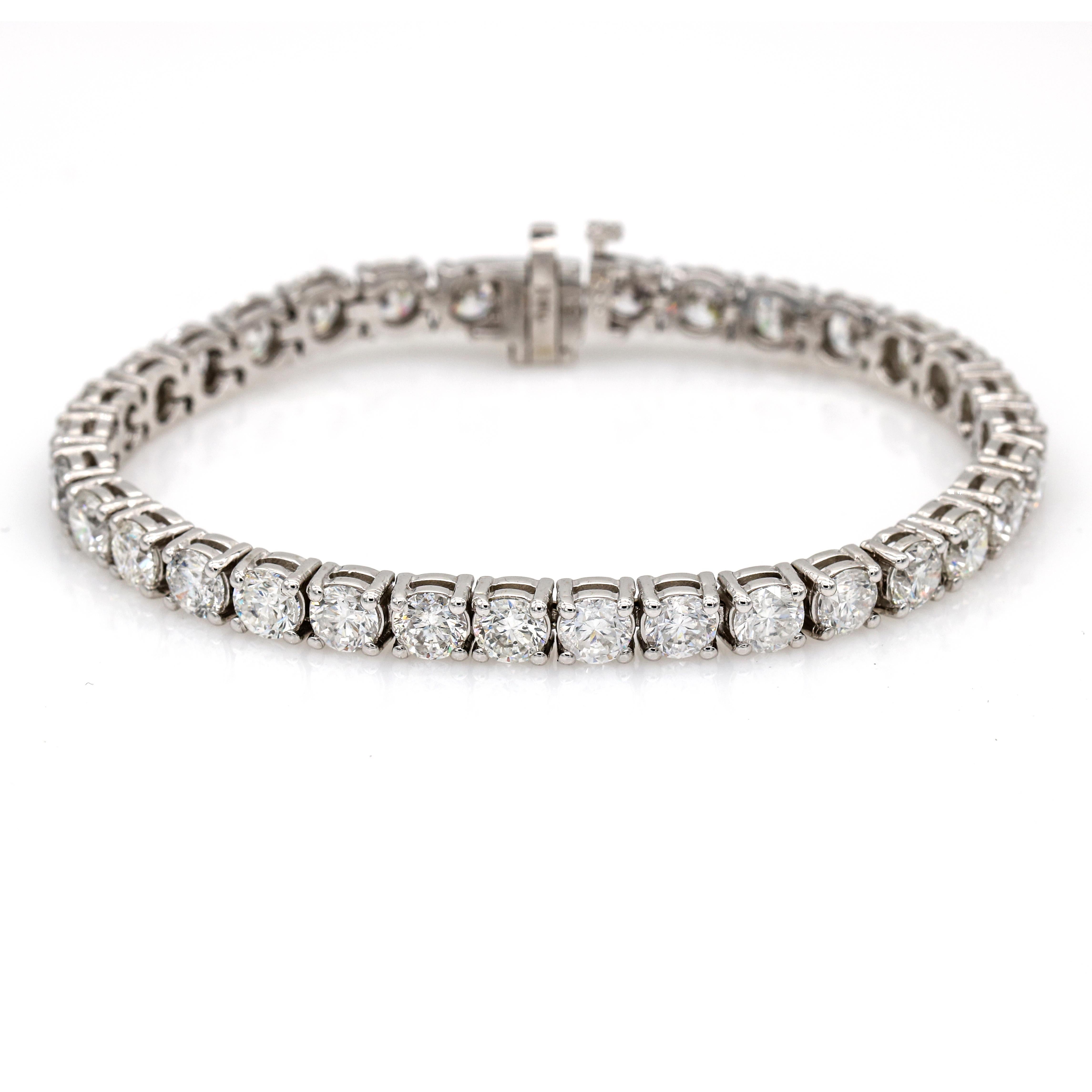 Stunning and dazzling, in 14-karat white gold, this Women's Classic Diamond Tennis Bracelet features 33 round brilliant cut diamonds that weigh 16.55 carats. The diamonds are secure in a classic slide clasp with safety. It is perfect for any