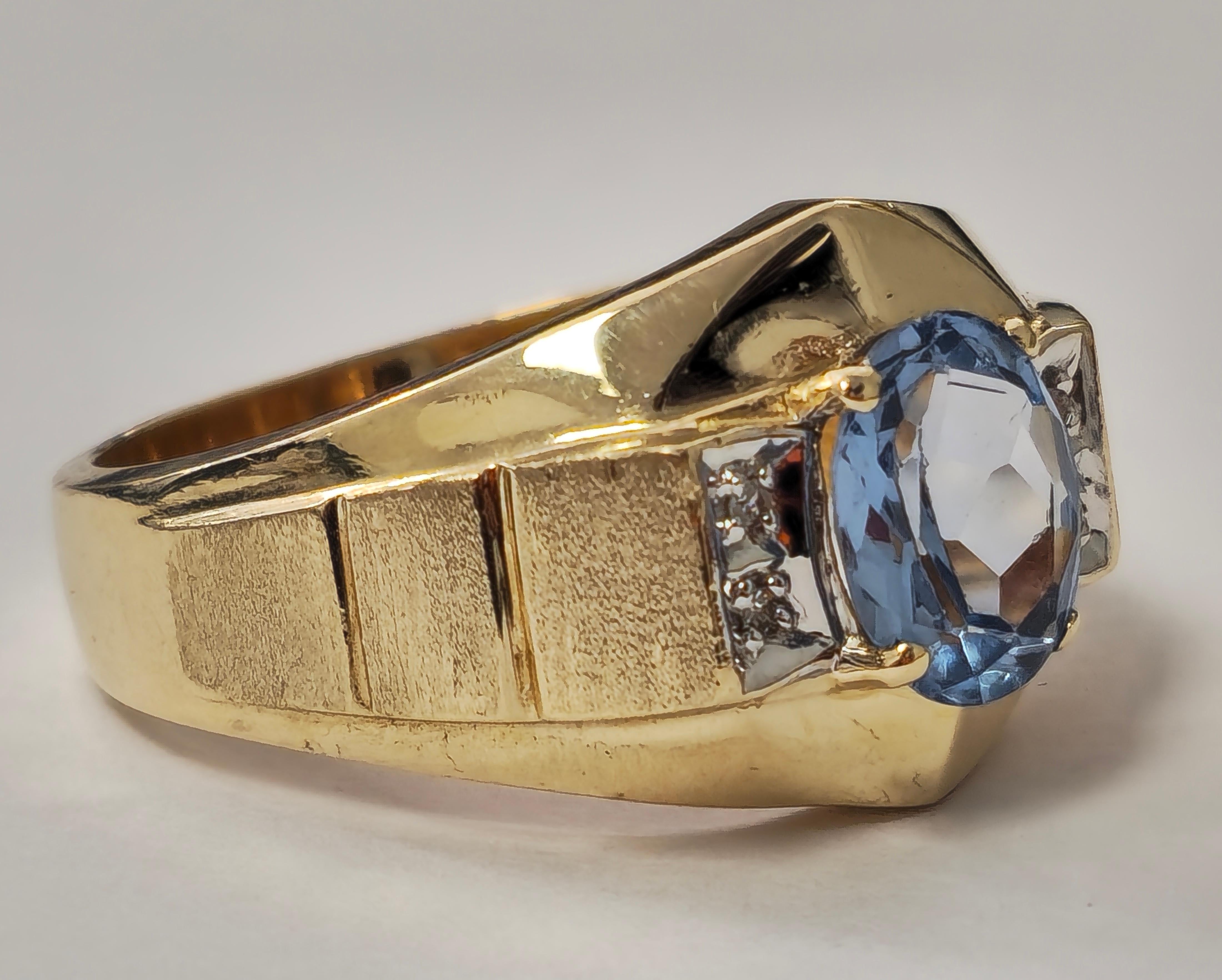 Fashioned from 10k yellow gold, this vintage cocktail ring features a striking 2.10 carat oval-cut aquamarine, exuding natural elegance. Adorned with a total of 0.15 carats of round-cut diamonds, boasting SI2 clarity and G color, the ring showcases