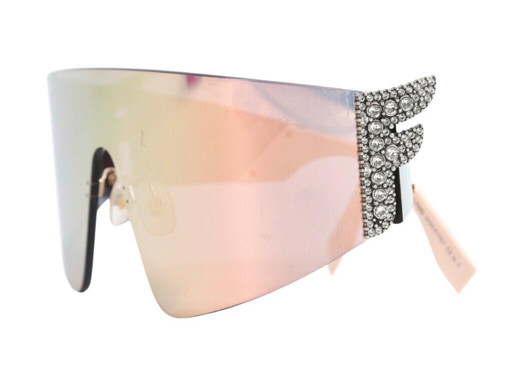 A lovely pair of Fendi sunglasses with diamonte F detail on the sides for sale. Purchased and stored – never used.

BRAND	
Fendi

ACCESSORIES	
Case, Cleaning Cloth

COLOUR	
pink

CONDITION	
As New

FEATURES	
Diamonte F detail on