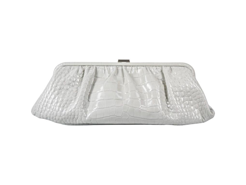 This gorgeous clutch, cross-body or shoulder bag by Balenciaga is made from leather with a moc croc design and finished with silver hardware. In as new condition.
Colour
White
Material
Leather
Hardware
Silver
Condition
As New
Height / Width/