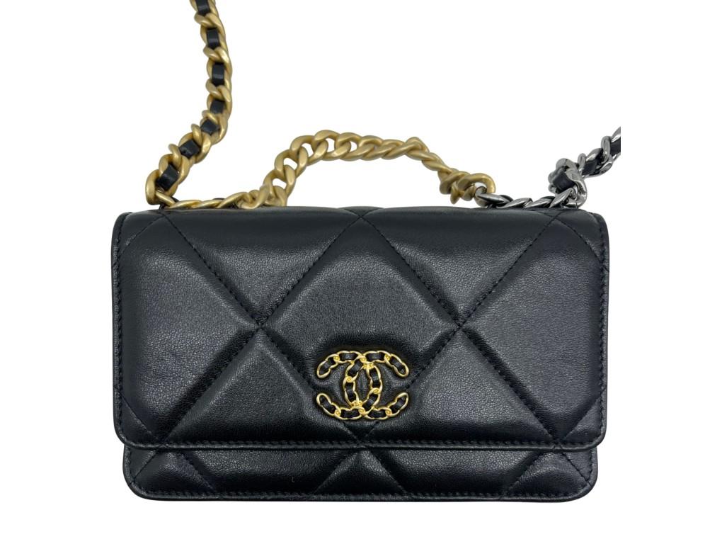 This is an exquisite piece, the Chanel 19 wallet on chain with 2 chains in black lambskin leather with gold, silver and ruthenium hardware. A new item for sale.

BRAND	
Chanel

FEATURES	
CC logo on the front, chain-link shoulder strap,