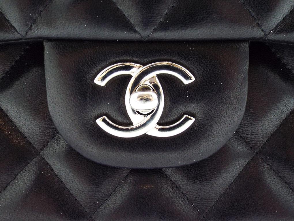 A wonderful Chanel Jumbo-sized Classic Double Flap bag for sale. Made from black lambskin leather with silver hardware. A preloved bag for sale in used, excellent condition – do look at photos.
BRAND	
Chanel

FEATURES	
CC Clasp Closure, One exterior
