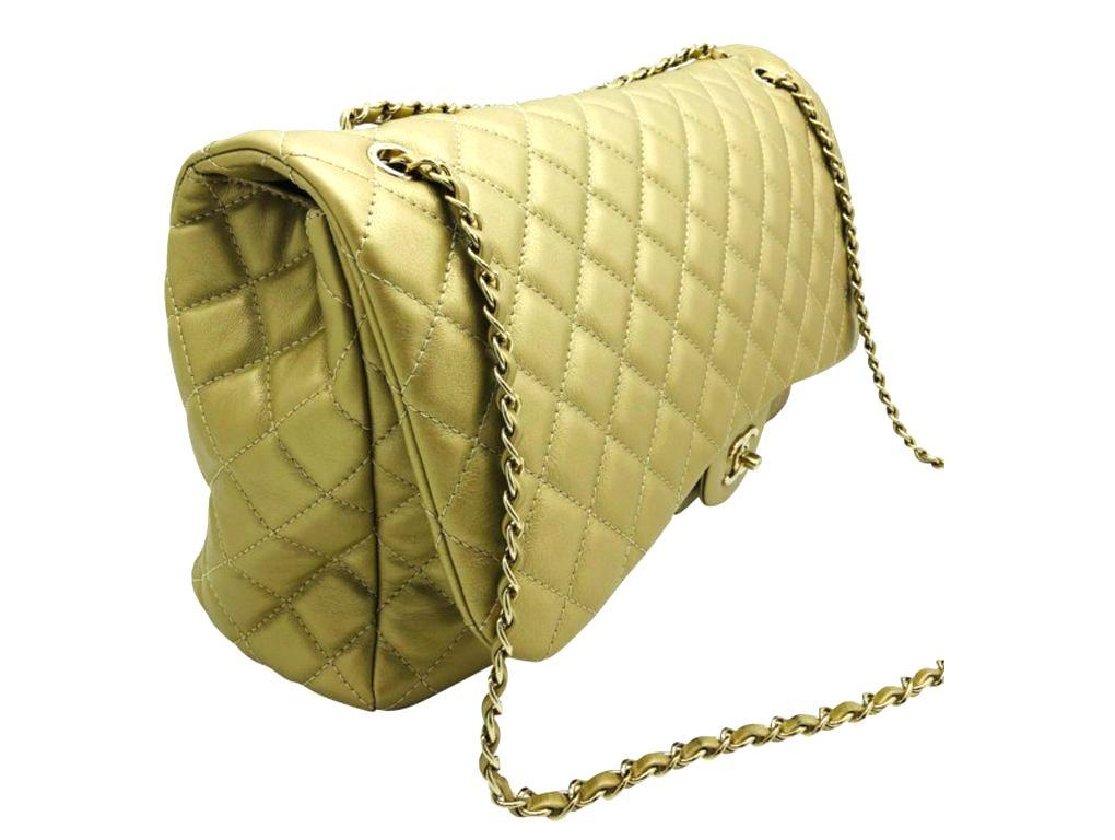 An absolutely stunning bag by Chanel for sale. This XXL Travel Flap bag in soft metallic gold calfskin leather is wonderful. A preloved item in very good condition.

BRAND	
Chanel

FEATURES	
CC Clasp Closure, One exterior slip pocket, One interior