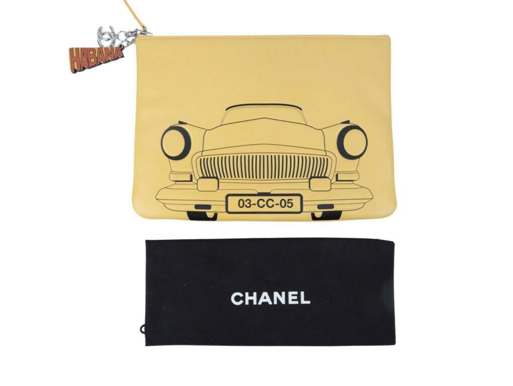 This is an exquisite piece, the Chanel Cuba Habana O Case in yellow soft lambskin leather. Wear as a clutch bag or pouch and made from yellow lambskin leather. Used lovingly and is in excellent condition.

BRAND	

Chanel



FEATURES	

Habana and CC