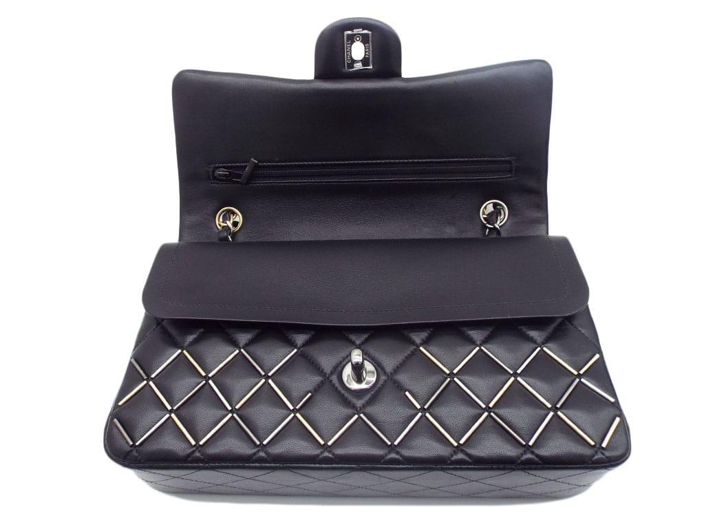 What a stunning beauty..! This Chanel Flap Bag is the iconic Chanel Classic Double Flap Bag in black lambskin, embellished with gold and silver beadwork. The bag has an interwoven leather chain strap which is two-toned in gold and silver. This bag
