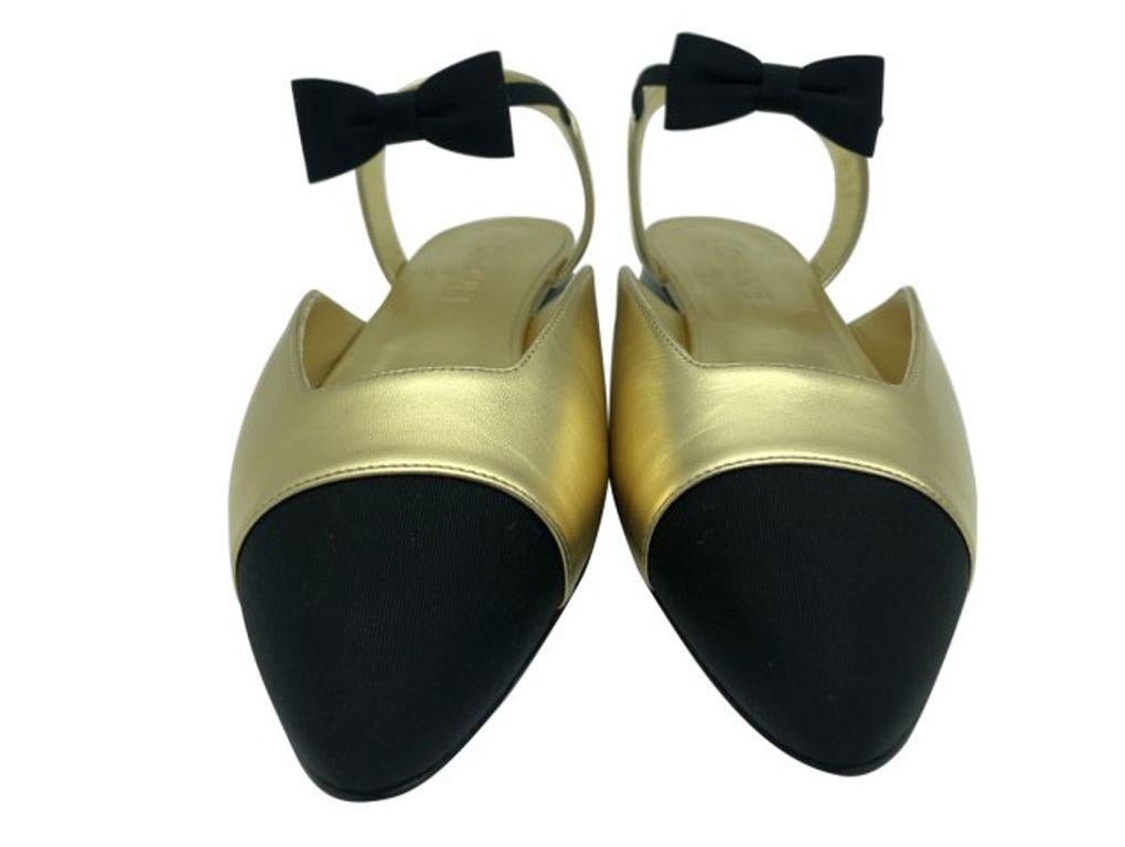 Gorgeous pair of gold and black pointed shoe from Chanel in a size 40.5c (UK 7.5c)The bow detail on the ankle is just exquisite. A new pair which have been tried on so do look at the photos of the sole.

BRAND	
Chanel

ACCESSORIES	
Box,