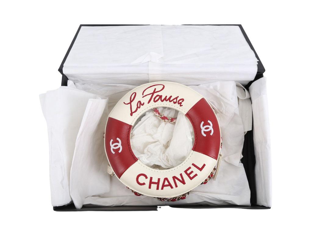 Just stunning.! This Chanel Limited Edition La Pausa shoulder bag, also known as the “Lifesaver” bag was made as part of the 2019 Cruise Collection in very Limited quantities. The bag has a see through middle to reveal the large CC logo on the back