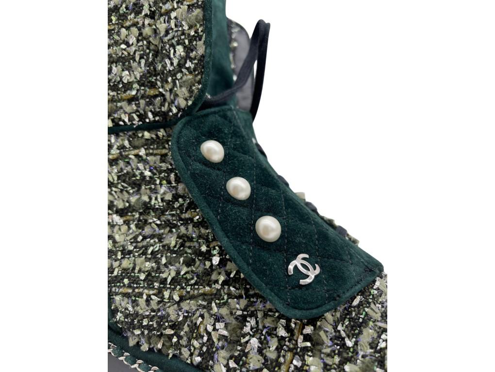 Beautiful and stunning Chanel green tweed and suede boots with pearl detail on the front.  

BRAND	
Chanel

FEATURES	
pearl detail, ankle Chanel boots, green tweed, green suede leather, CC