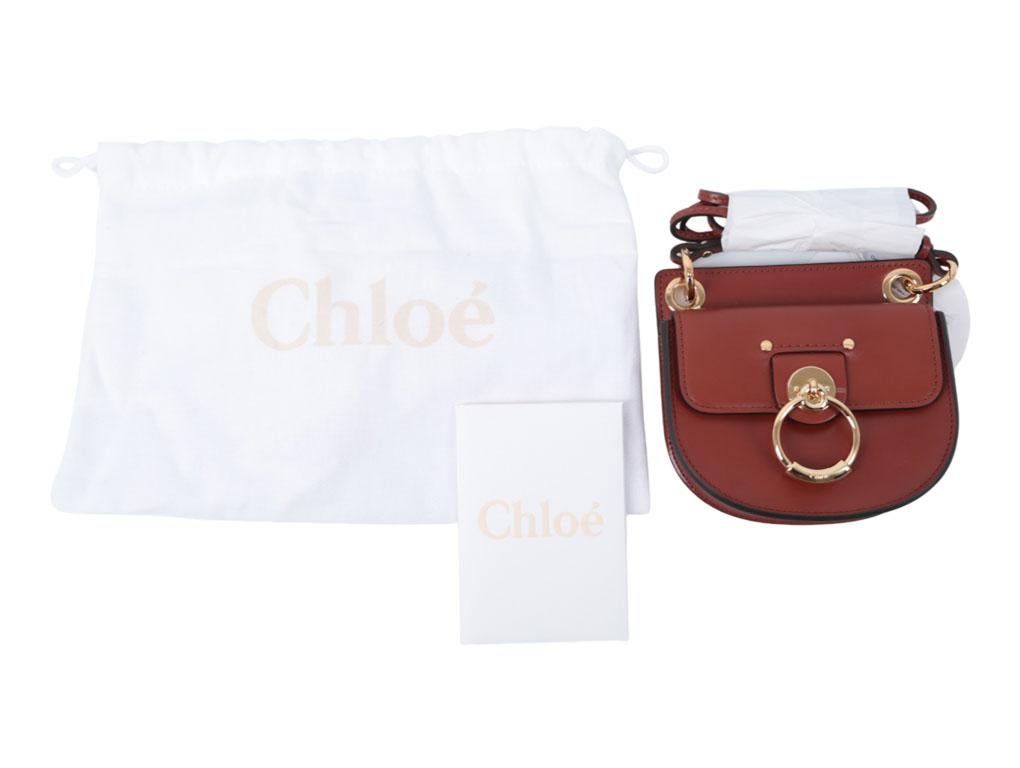 uch a cutie pie.! This Mini Tess bag from Chloe is divine. A new piece available for sale.



BRAND	

Chloe



FEATURES	

front flap pocket, gold tone ring detailing, slim shoulder strap, tonal stitching, top