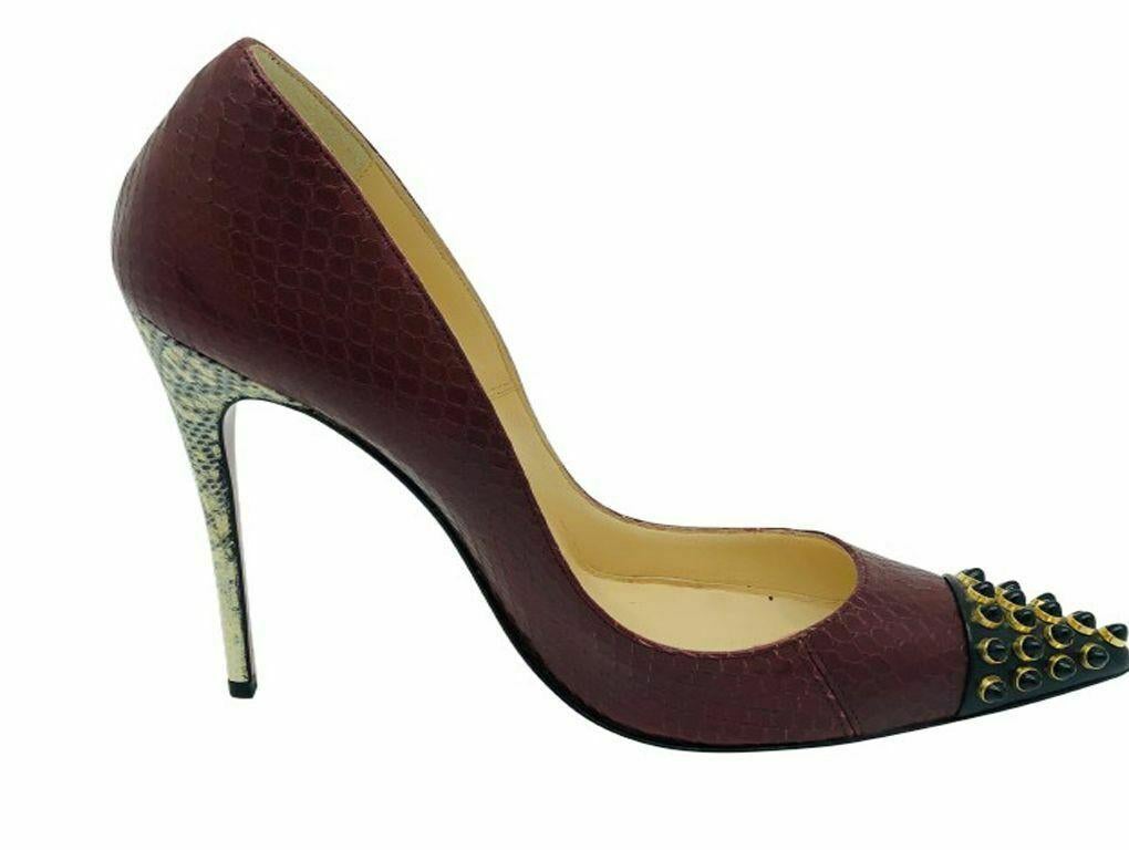 A gorgeous pair of Louboutin Python and Snakeskin heeled pumps.  Truly breathtaking with signature red bottoms. A preloved pair which are in Excellent condition.

BRAND	
Christian Louboutin

COLOUR	
Black, Maroon,
