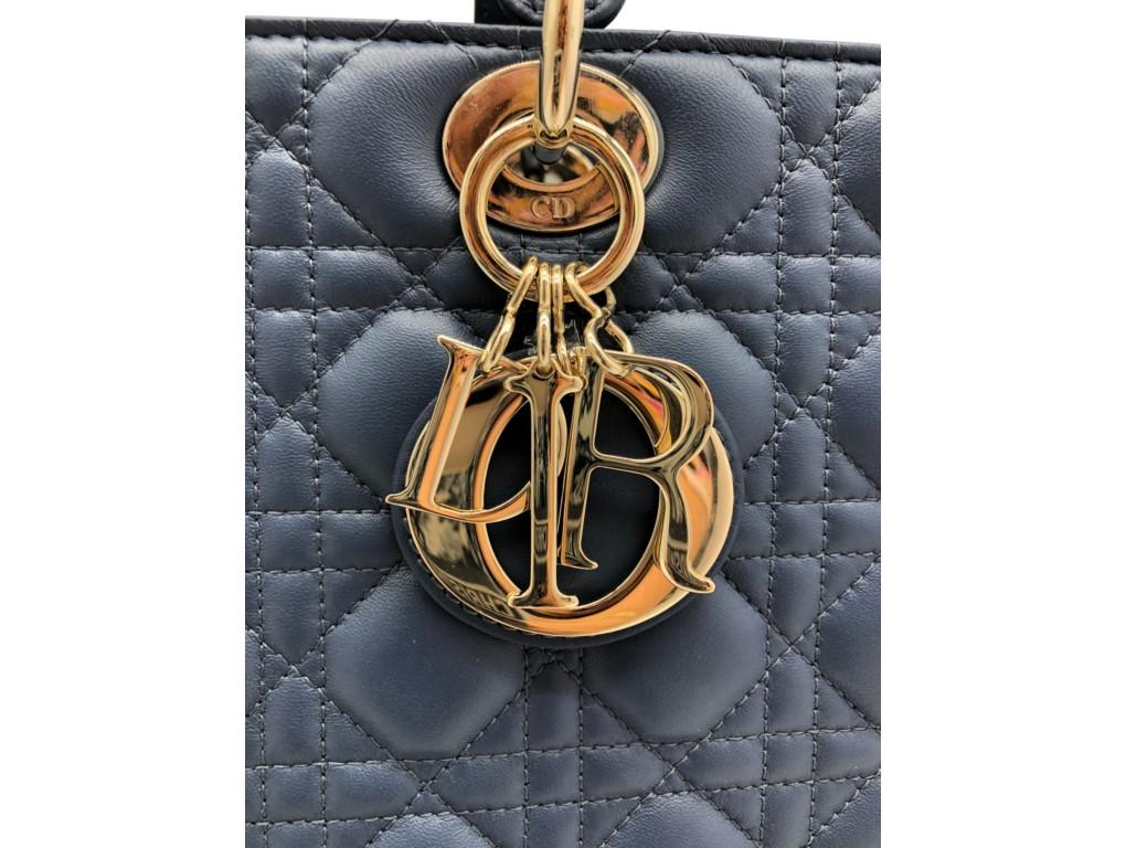 Exquisite bag by Dior – the Dior Lady bag in Dark Denim Blue coloured Lambskin leather. Made in the exquisite cannage design with soft gold hardware. Purchased and never worn, just stored.

BRAND	
Dior

FEATURES	
detachable strap, one interior