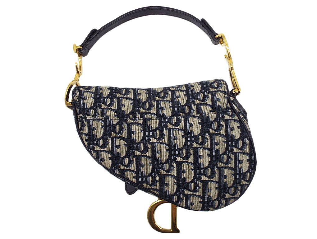 Unicorn Alert..! Gorgeous Navy classic oblique Mini Saddle bag from Dior with gold hardware, just exquisite. A preloved bag in very good condition.
BRAND	
Dior

FEATURES	
Magnetic Flap Opening, One interior compartment, Slip Back