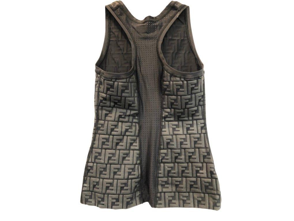 Sleeveless tank top by Fendi in technical fabric. All-over embossed FF logo and breathable fabric on the back. Worn once and in excellent condition.

BRAND	
Fendi

FEATURES	
Breathable fabric, FF Mono 

MATERIAL	
78% polyamide, 22%