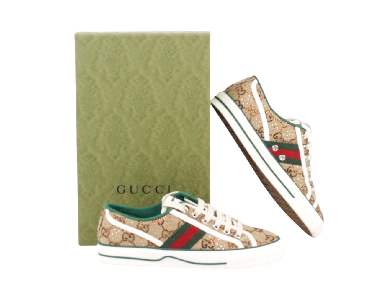 Stunning pair of Gucci GG Crystal Embellished Tennis Shoe/Trainer 1977 for sale. Worn once and in as new condition. Made in a size 38.5 (UK 5.5).

Colour
Beige, Green, Red
Material
Leather Canvas, Crystals
Hardware
Silver
Condition
Used