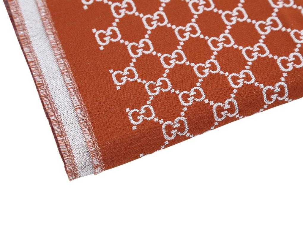 Gorgeous rust and silver scarf by Gucci featuring GG logo throughout. A new scarf for sale.

BRAND
Gucci

ACCESSORIES 
Tag, Plastic bag

COLOUR
Rust, Silver

FEATURES 
GG Logo

MEASUREMENTS
70cm x 200cm

MATERIAL
60% Cotton, 32% Viscose, 8% Fibre 